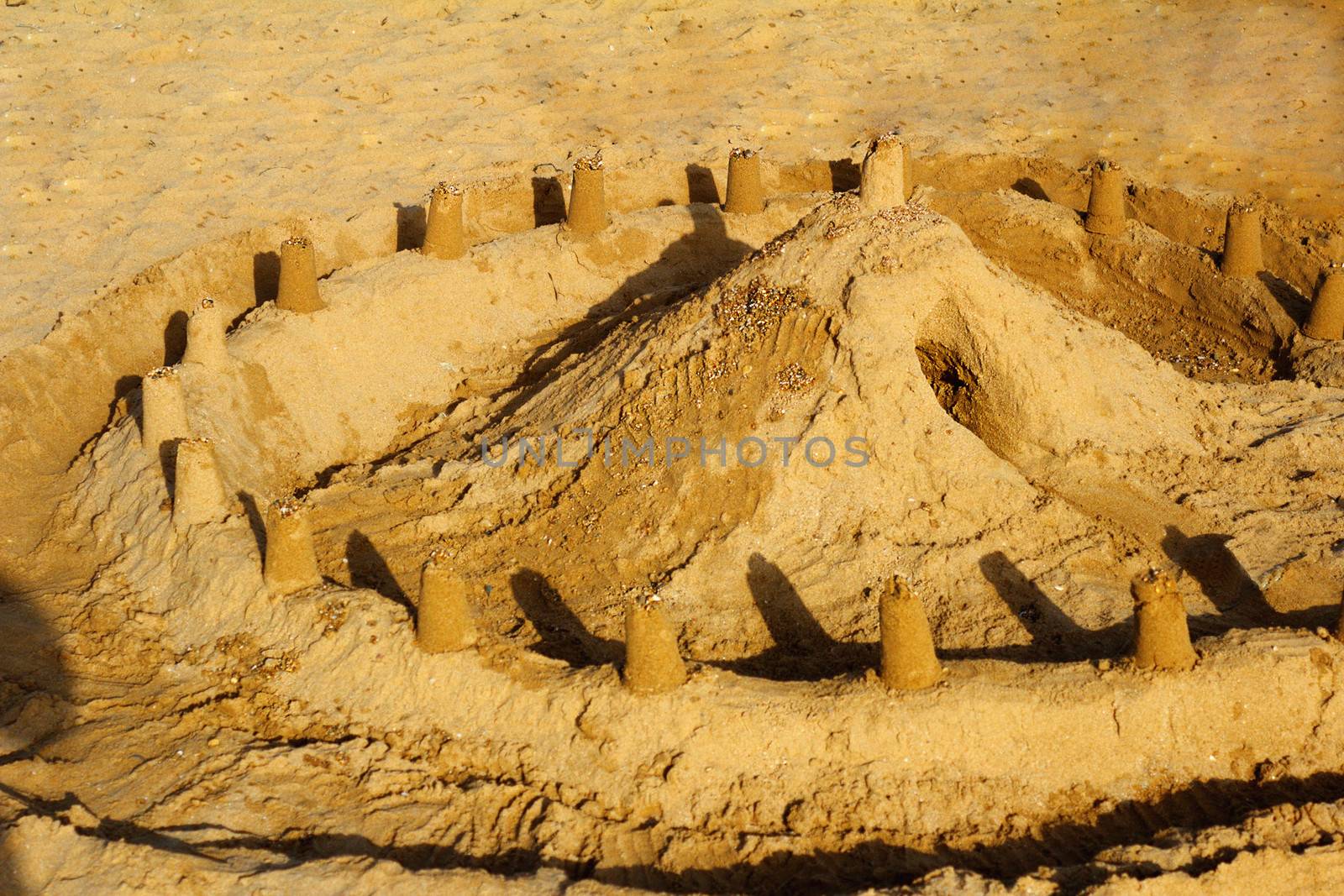 The castle and the fortress wall, built children of sand on a be by georgina198