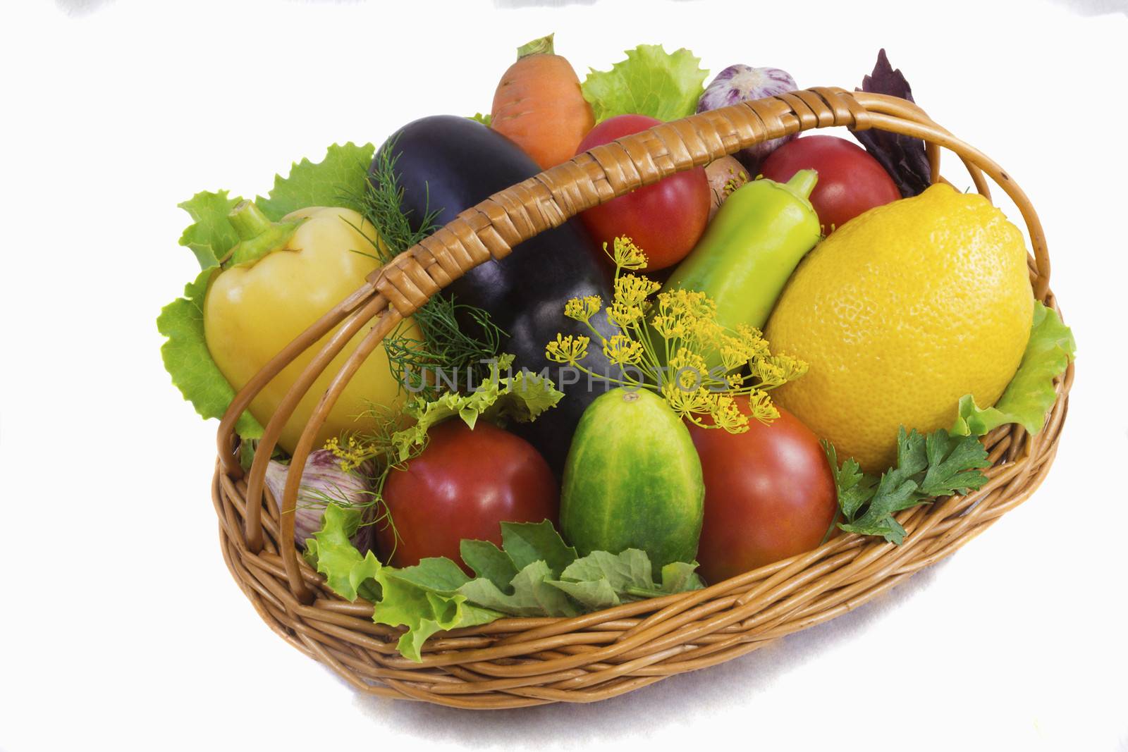 Basket with fruits and vegetables , photographed on a white back by georgina198