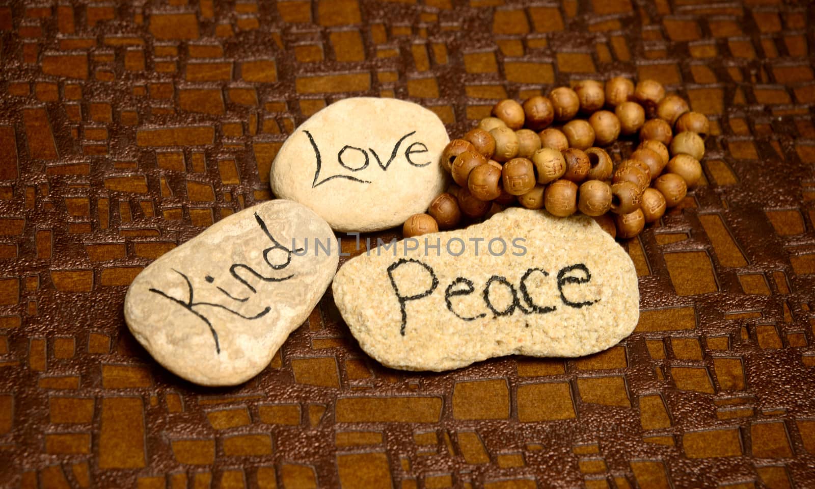 peaceful scene with rocks with words peace, love and kind for meditation