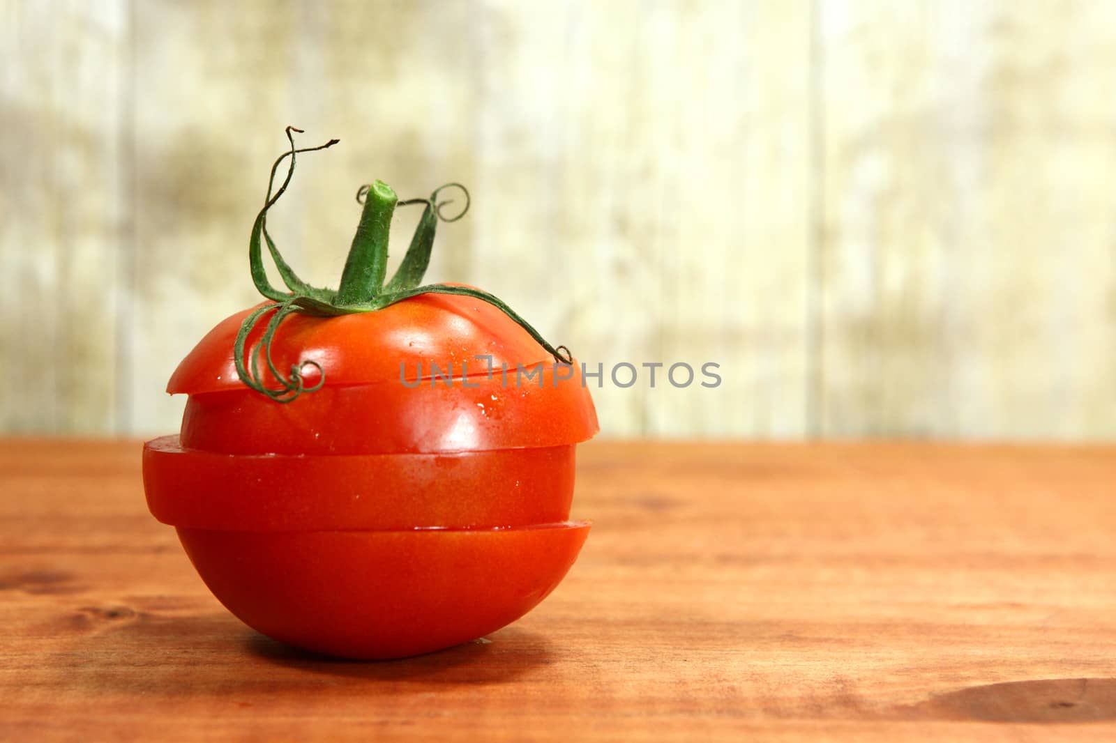 Red Hothouse Tomatoes on a Rustic Wood Plank