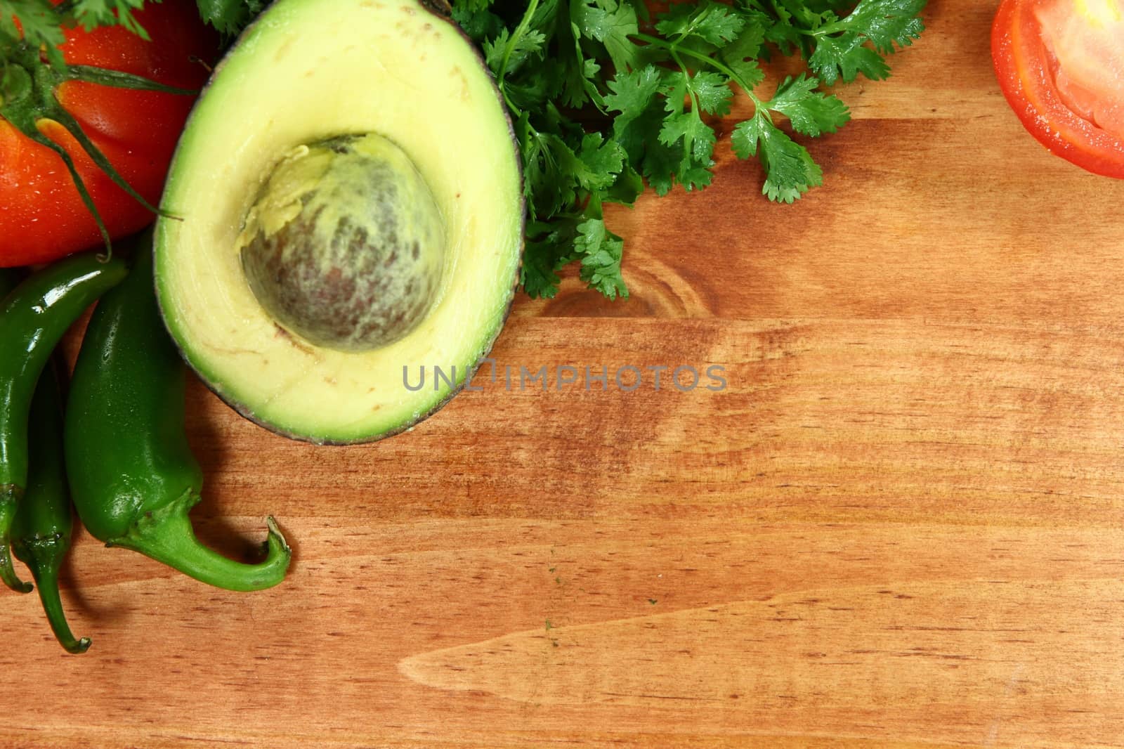 Salsa Ingredients of Avocado, Cilantro, Tomatoes and Peppers by tobkatrina