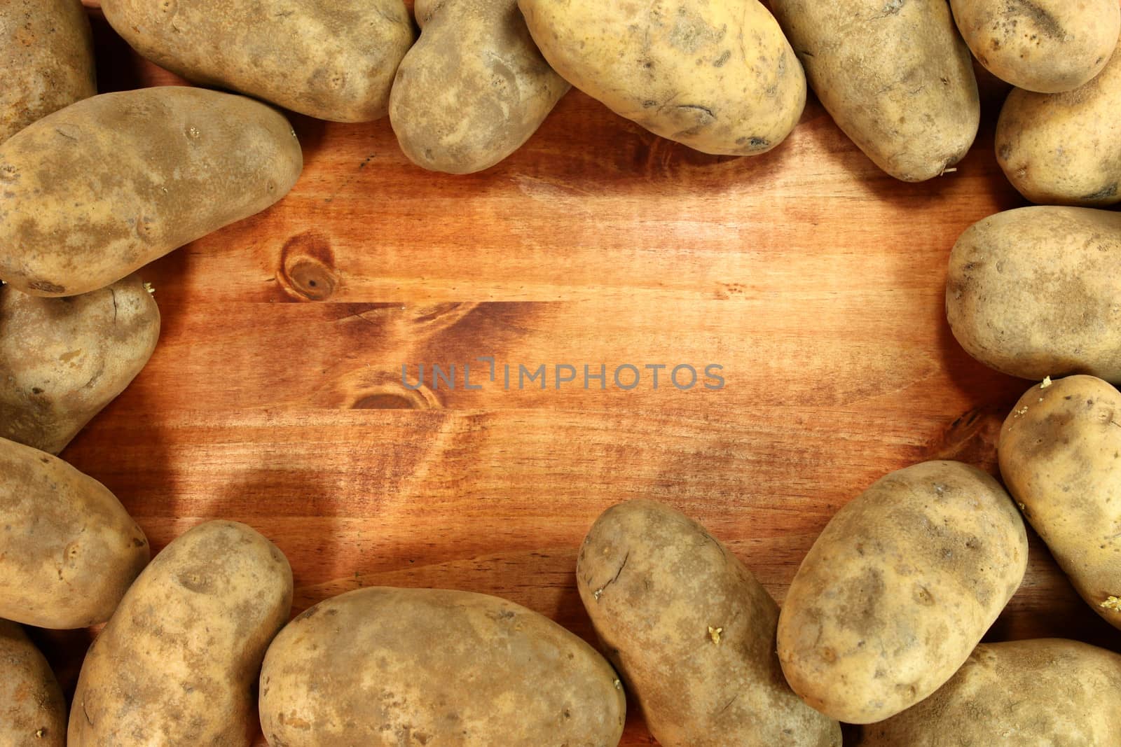 Framed Image of Russet Potatoes on a Wooden Background