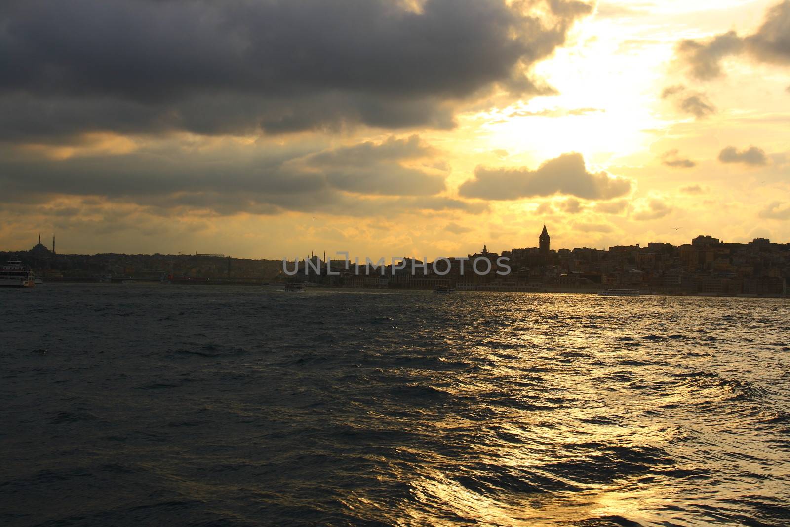 silhoutte of istanbul city with galata tower by mturhanlar