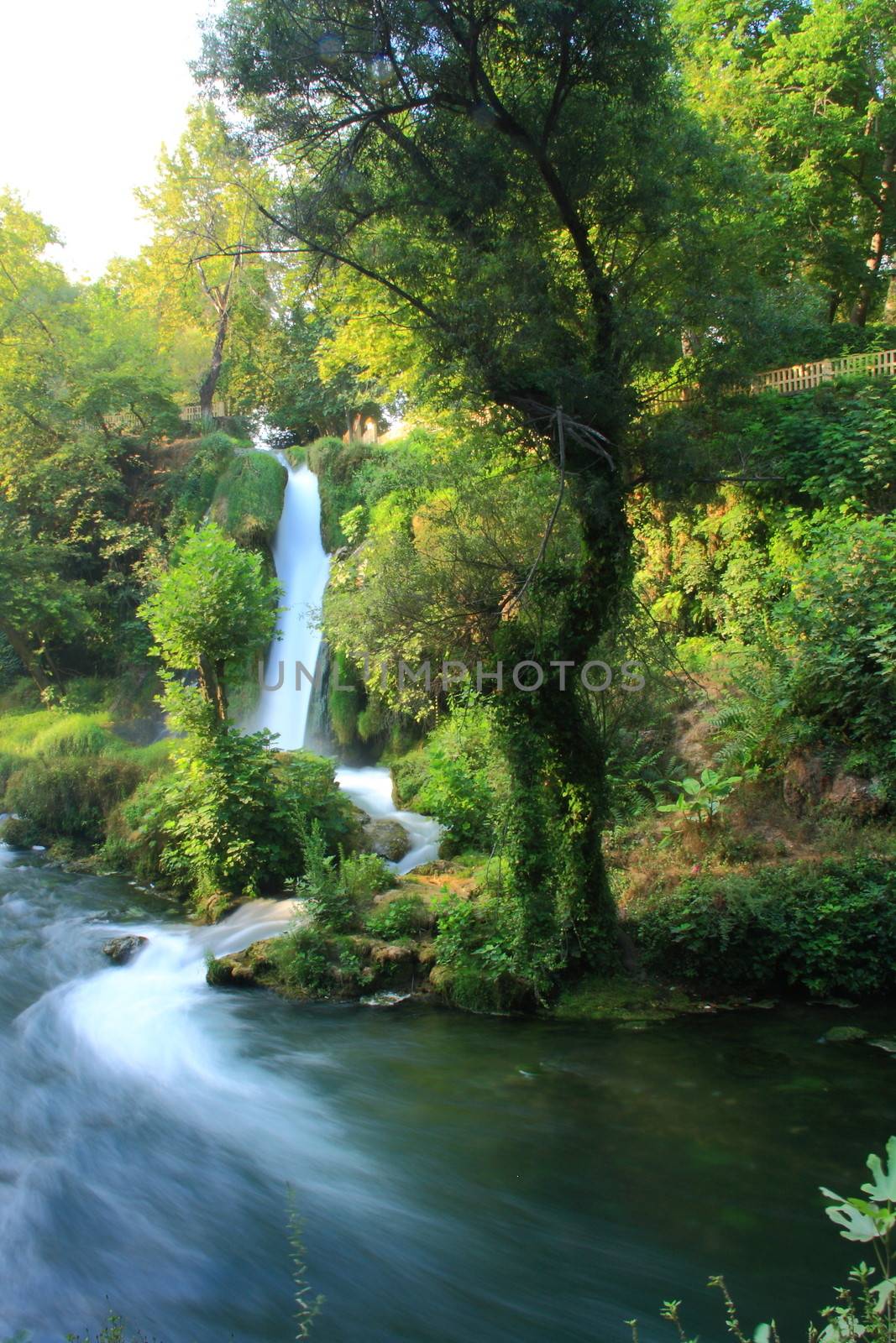 waterfall view in duden with green trees by mturhanlar