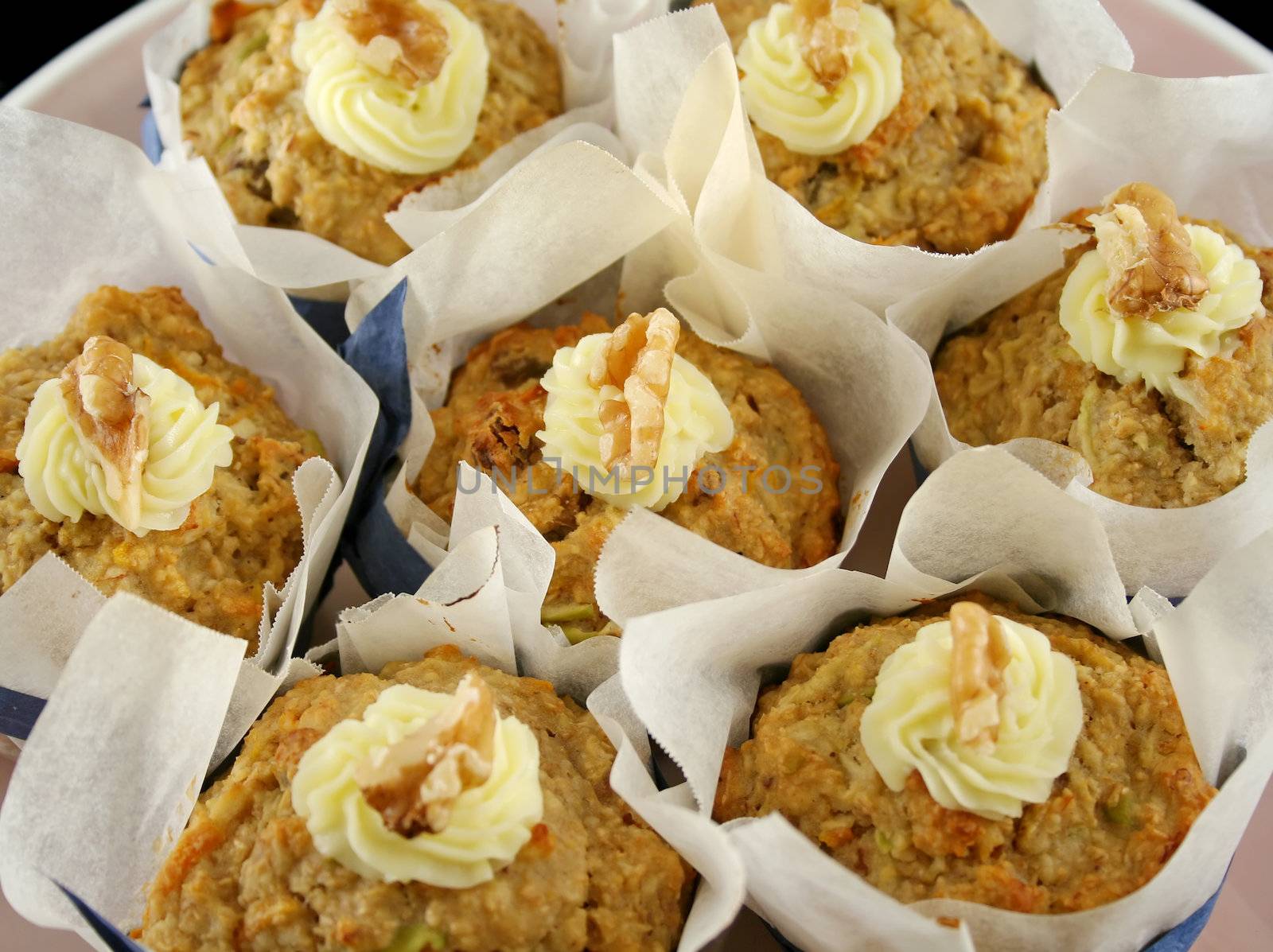 Homestyle fresh baked fruit muffins with cream cheese and walnuts.