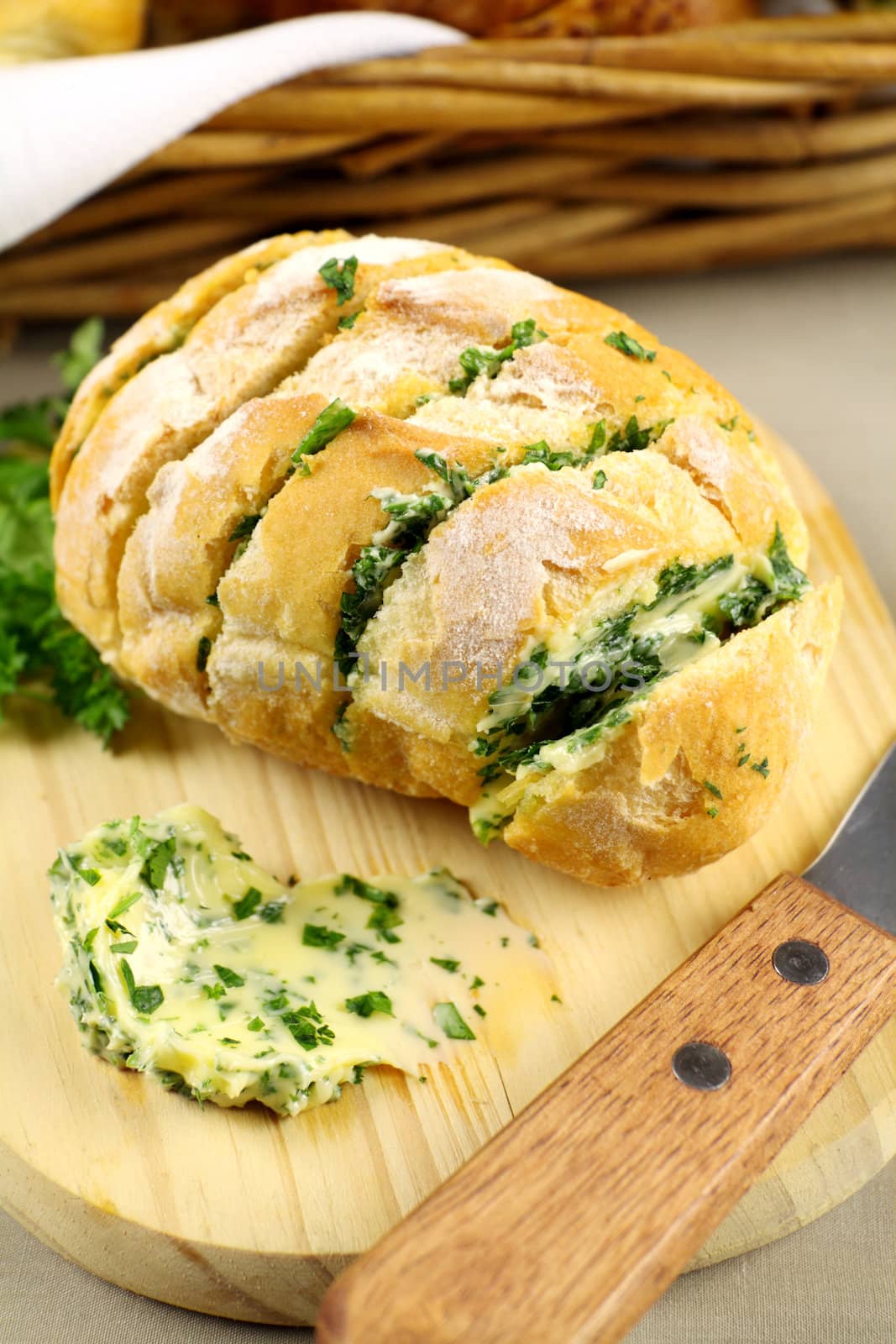 Fresh baked sliced herb and garlic roll from the oven.