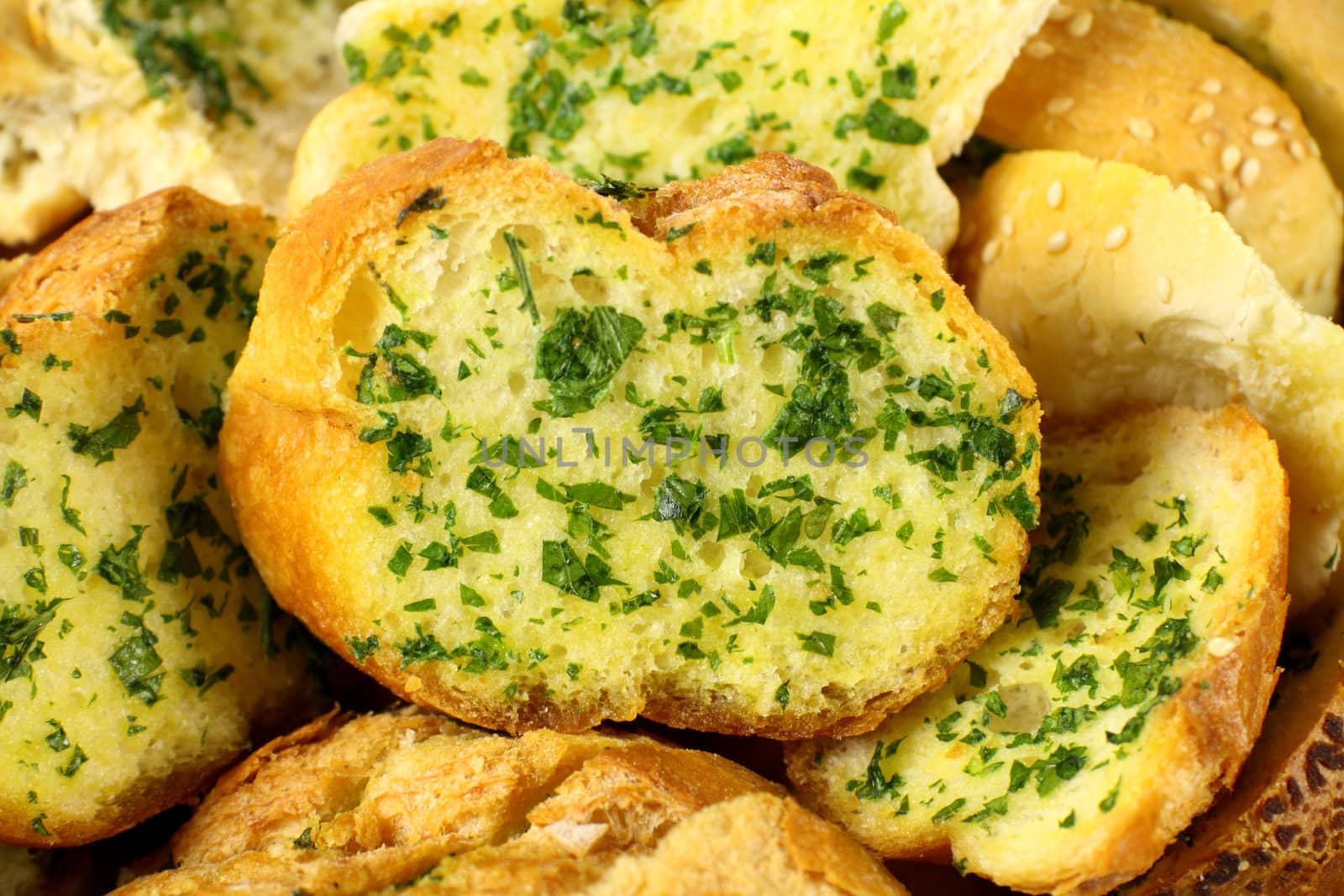 Delicious homemade herb and garlic crusty bread ready to serve.