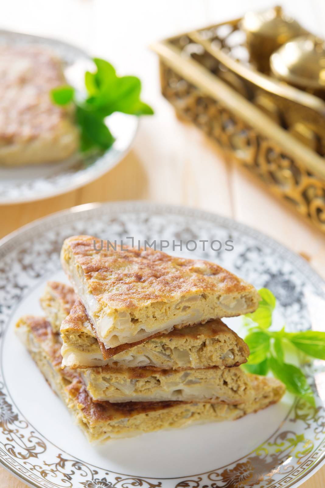 Mutabbaq or Murtabak is a stuffed Arabic bread, also known as "Fatatari" in some parts of Middle East.
