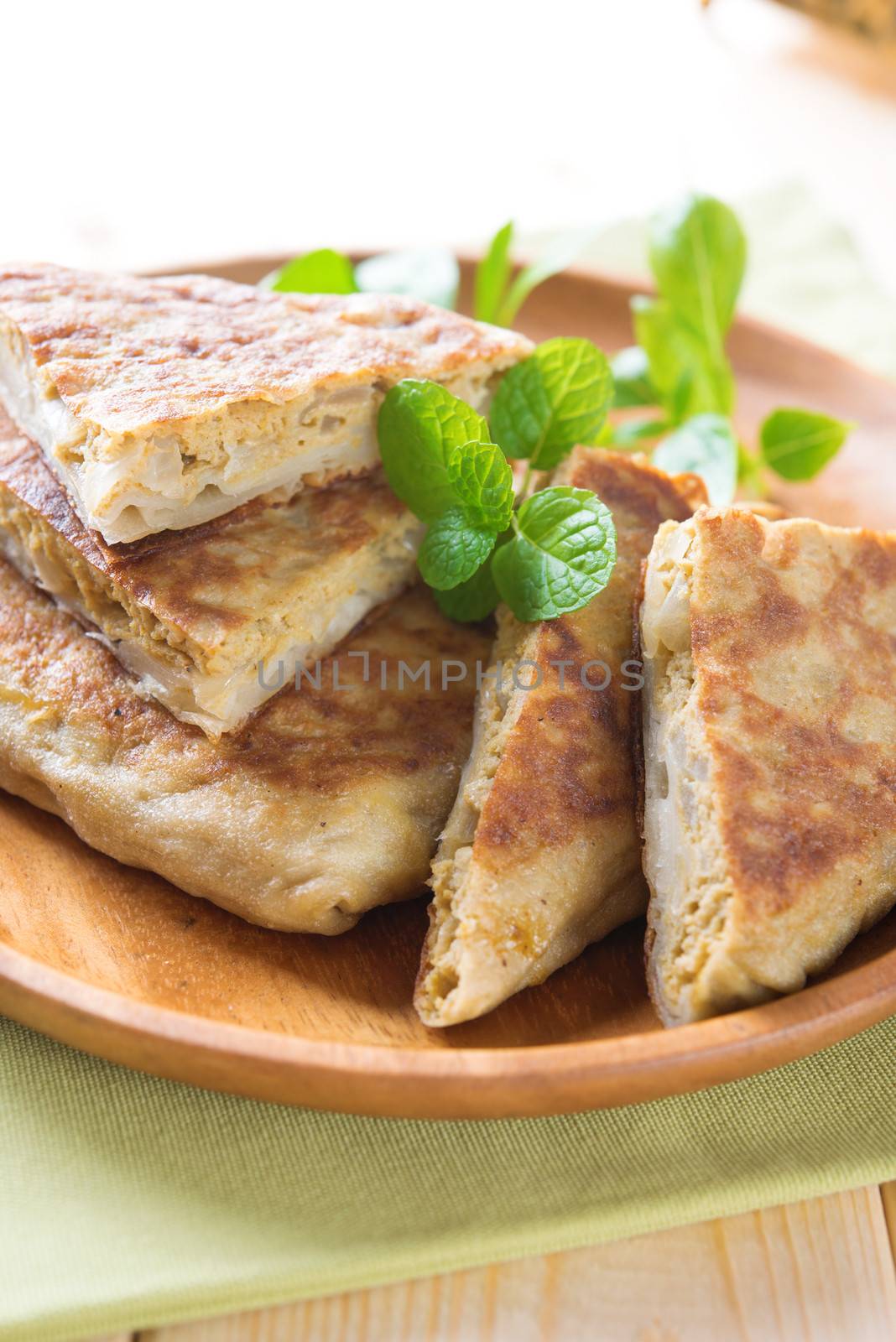 Stuffed pancake or pan-fried bread, martabak or murtabak, also mutabbaq 