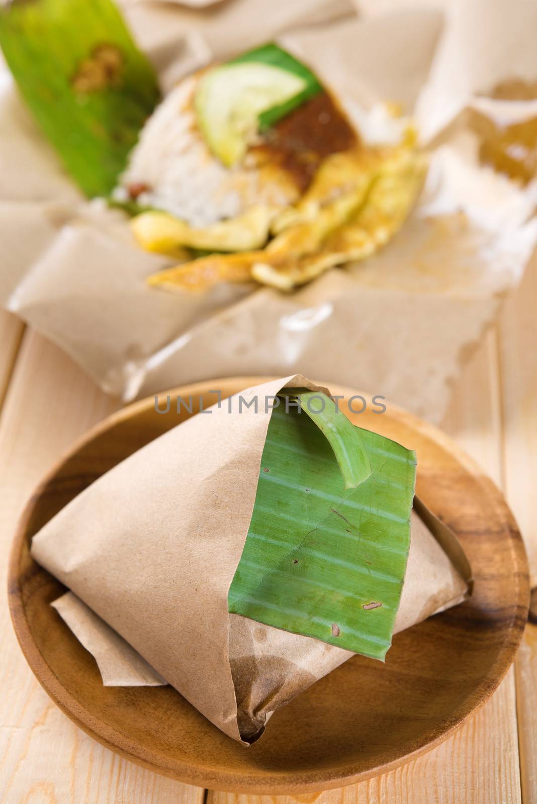 Nasi lemak - traditional Malaysian breakfast on banana leaf