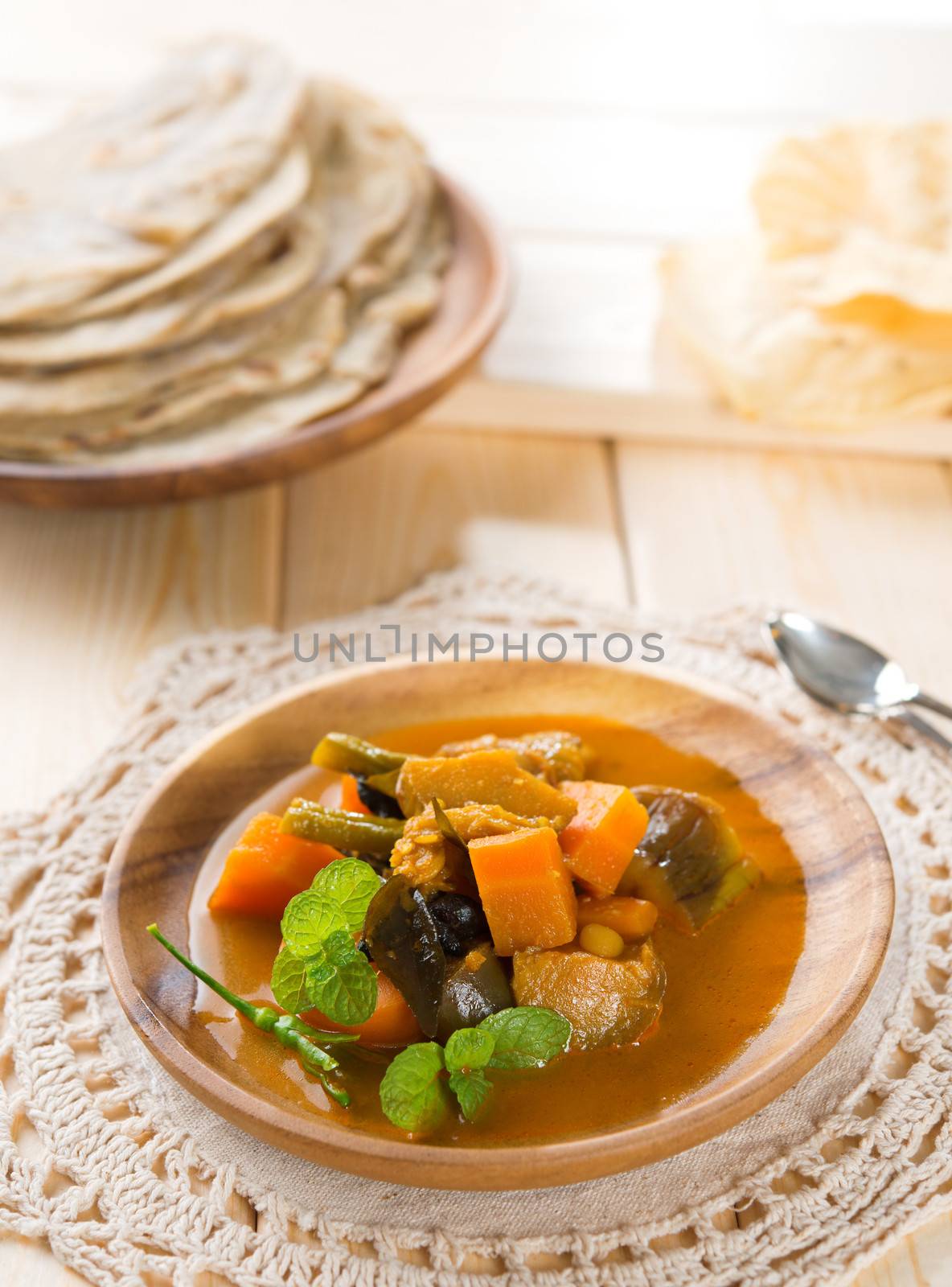 Vegetable curry dhal, chapatti roti or Flat bread and papadom. Indian food on dining table.