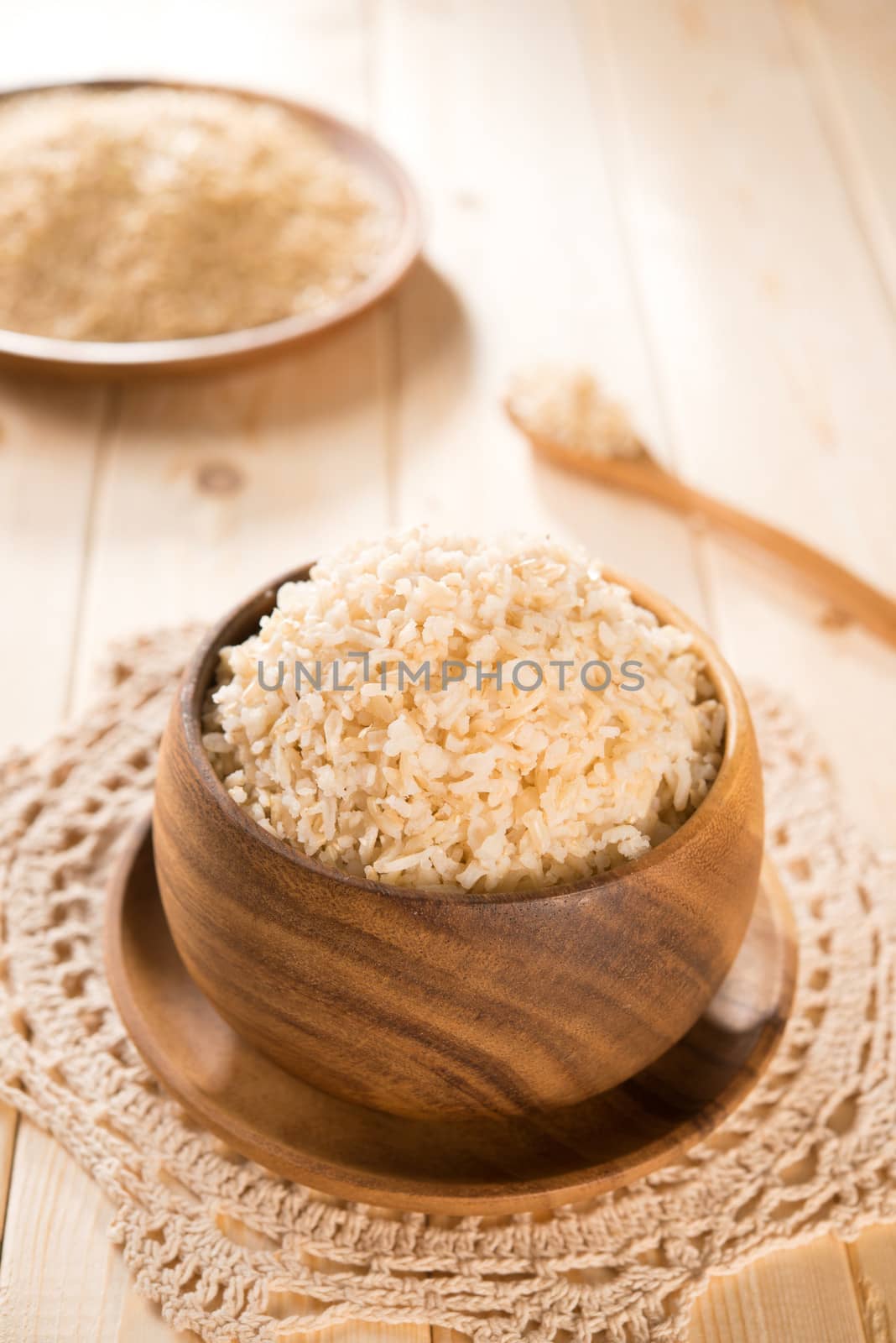India organic basmati brown rice in wooden bowl on dining table.