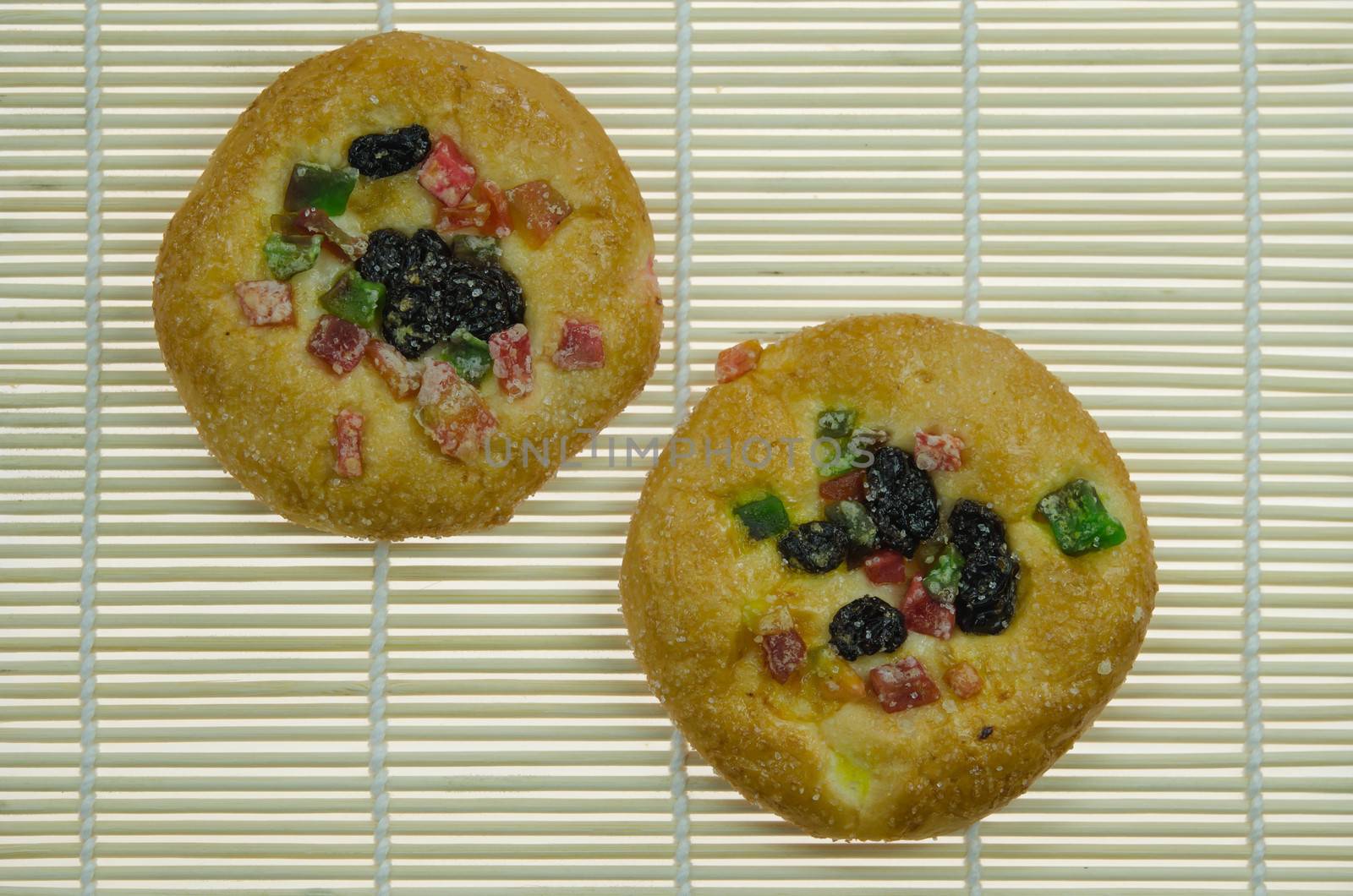 top view two sweet bread with raisin and  dried fruits  on wooden background