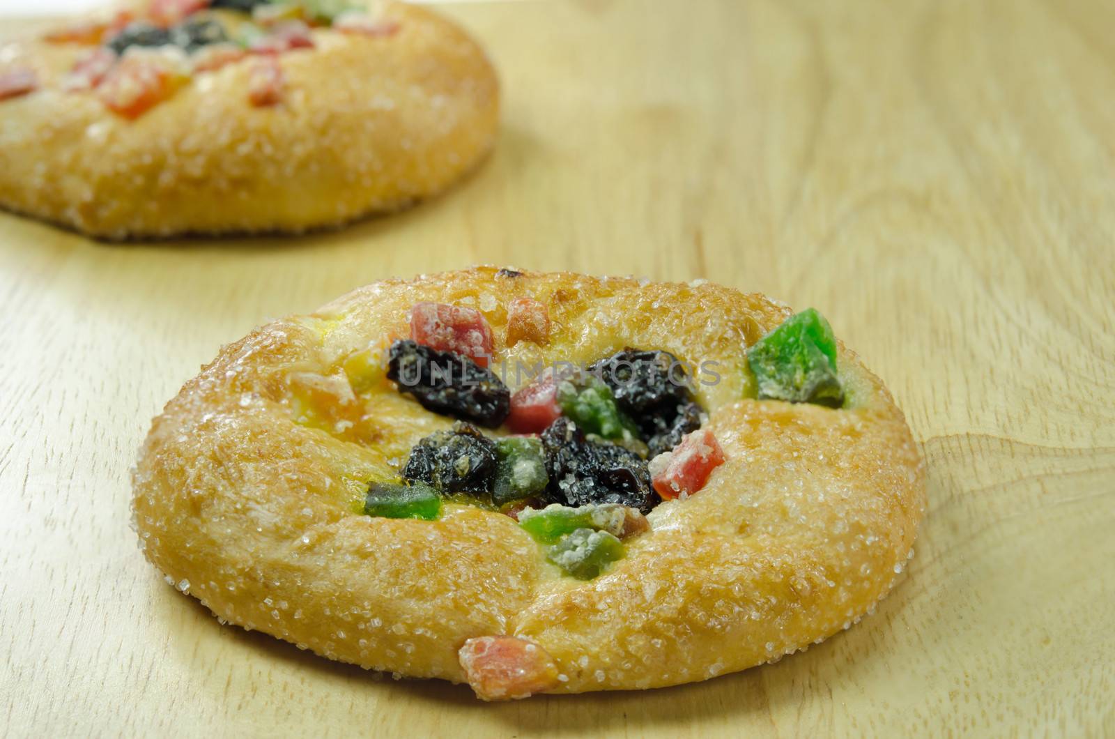 close up  bread with raisin and  dried fruits  on wooden board 