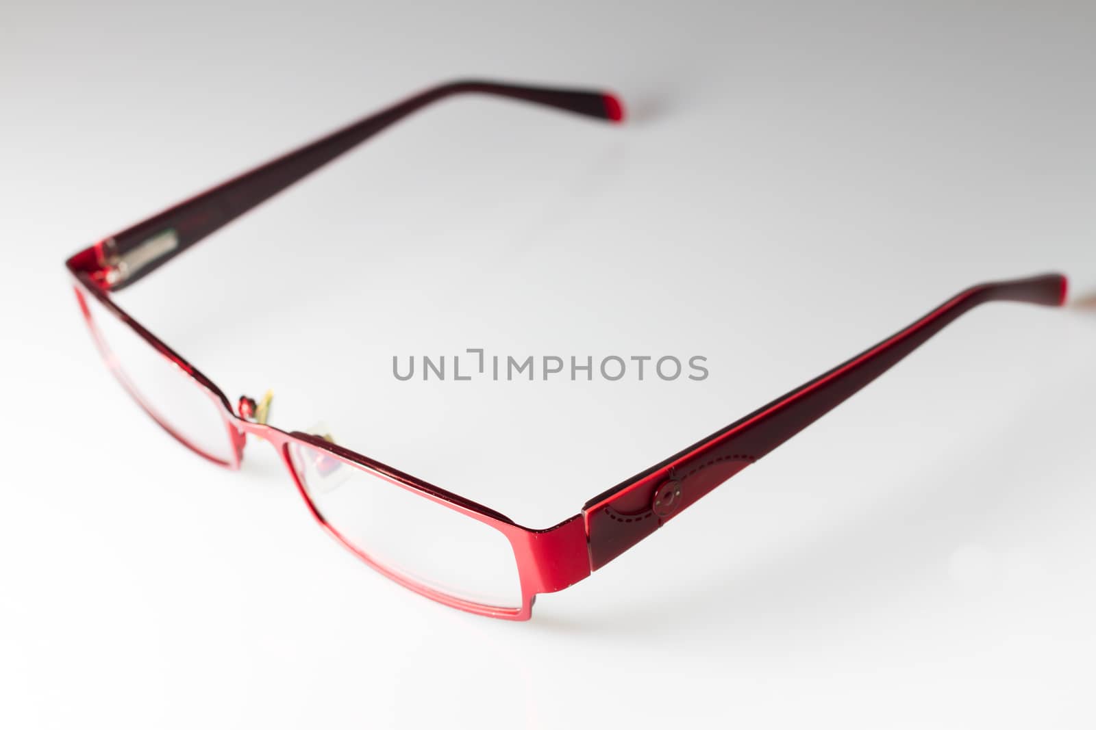 Red spectacles on isolated white background