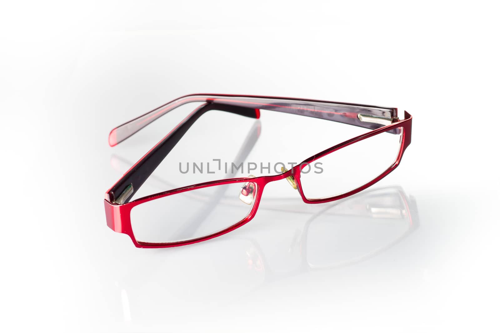 Red spectacles on isolated white background