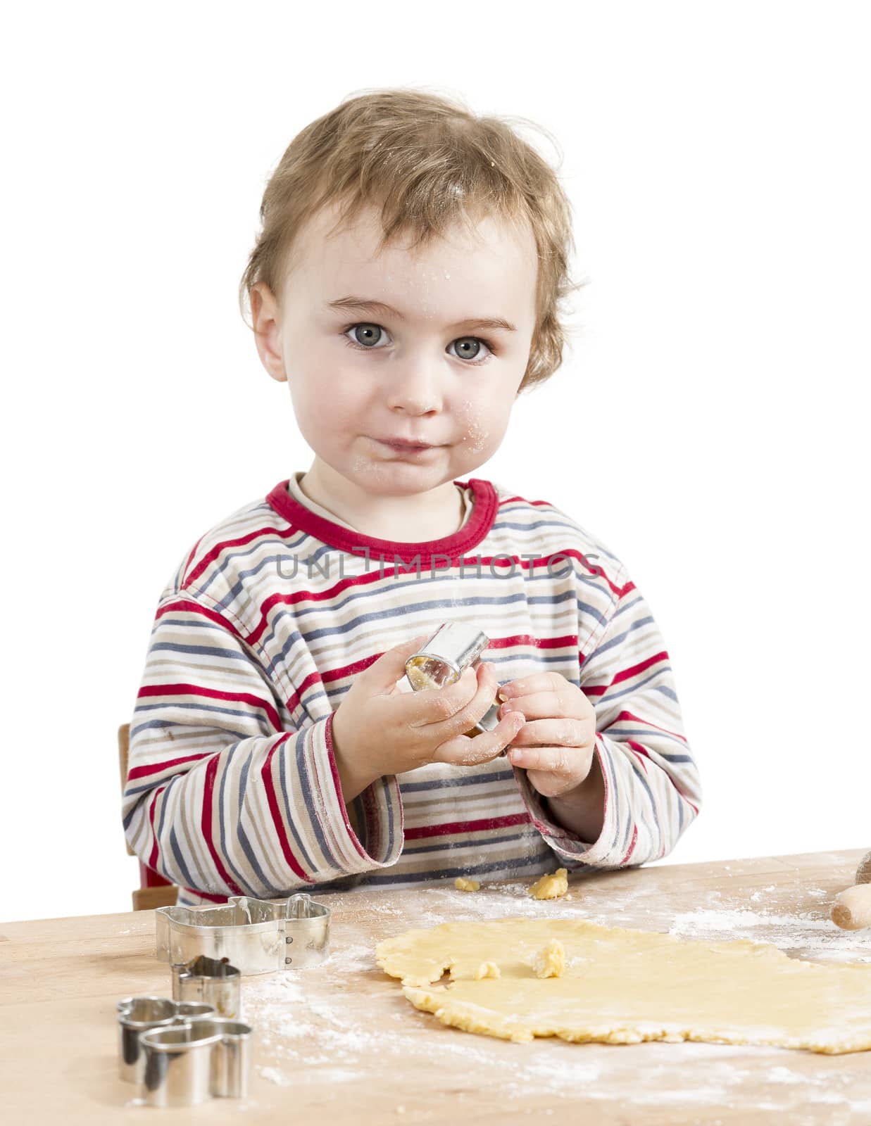 cute child with dough isolated on white background. horizontal image