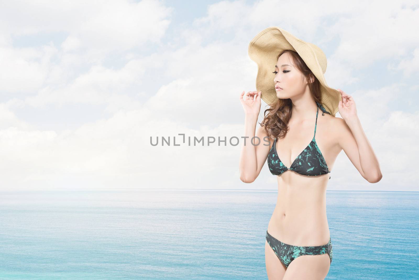 Young woman during summer vacation on beach.