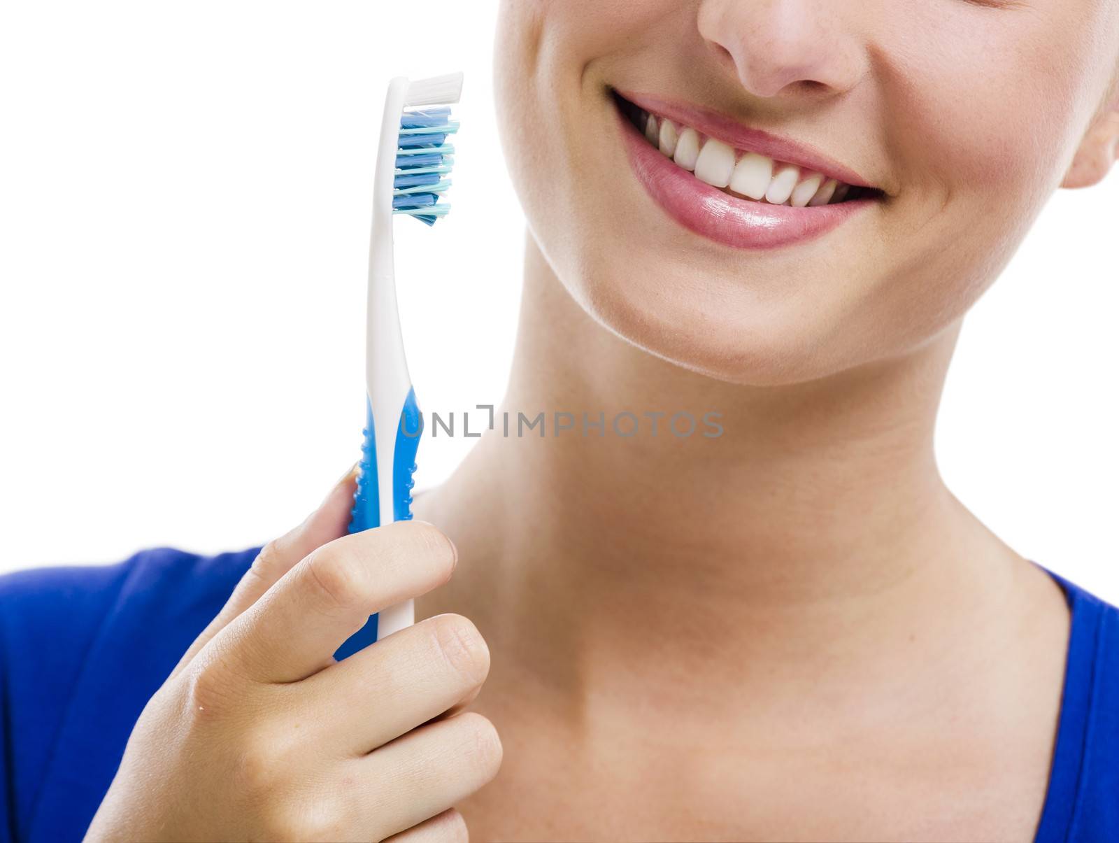 Beautiful woman with a great smile holding toothbrush, isolated over a white background