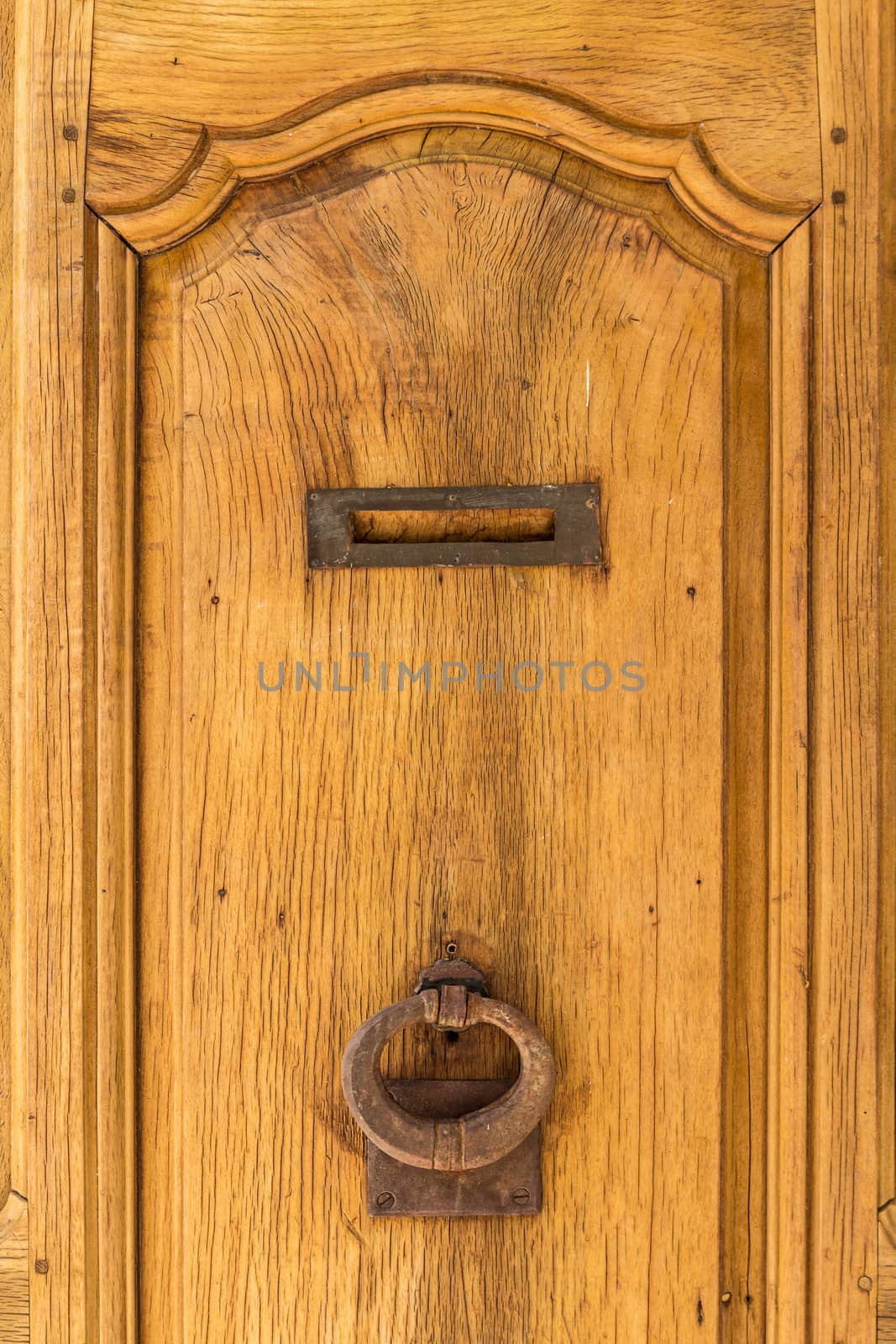 Door knock on a yellow wooden door