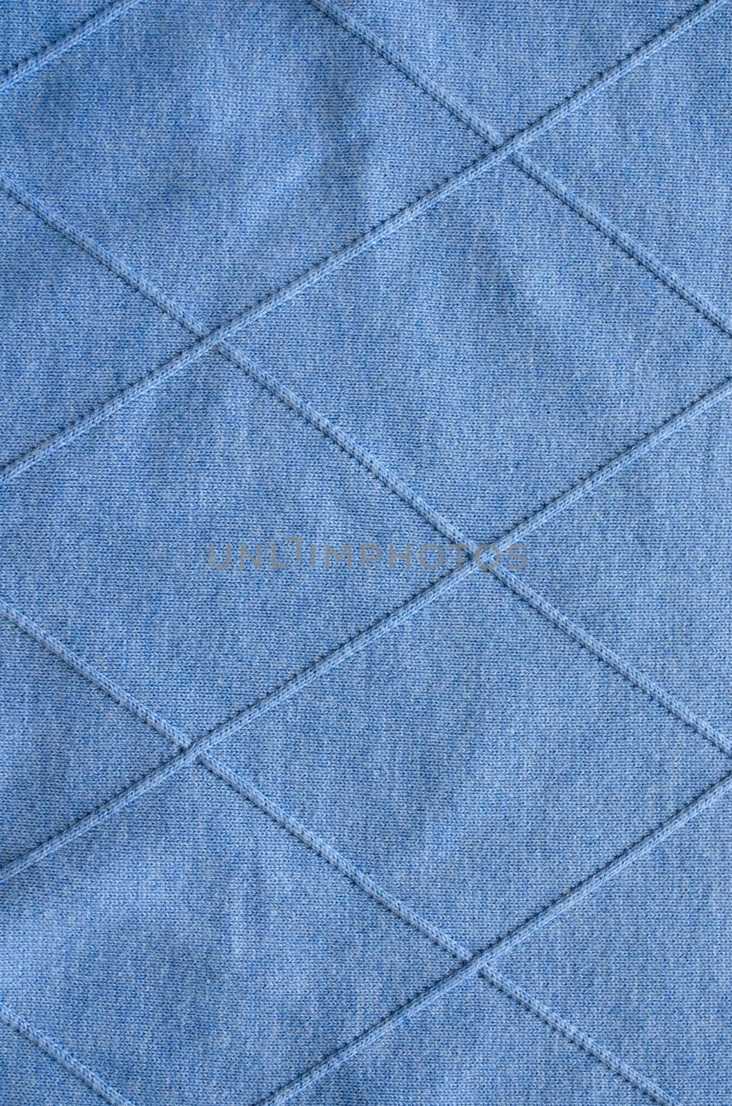 background of cross lines on knitted blue sweater pattern fabric.