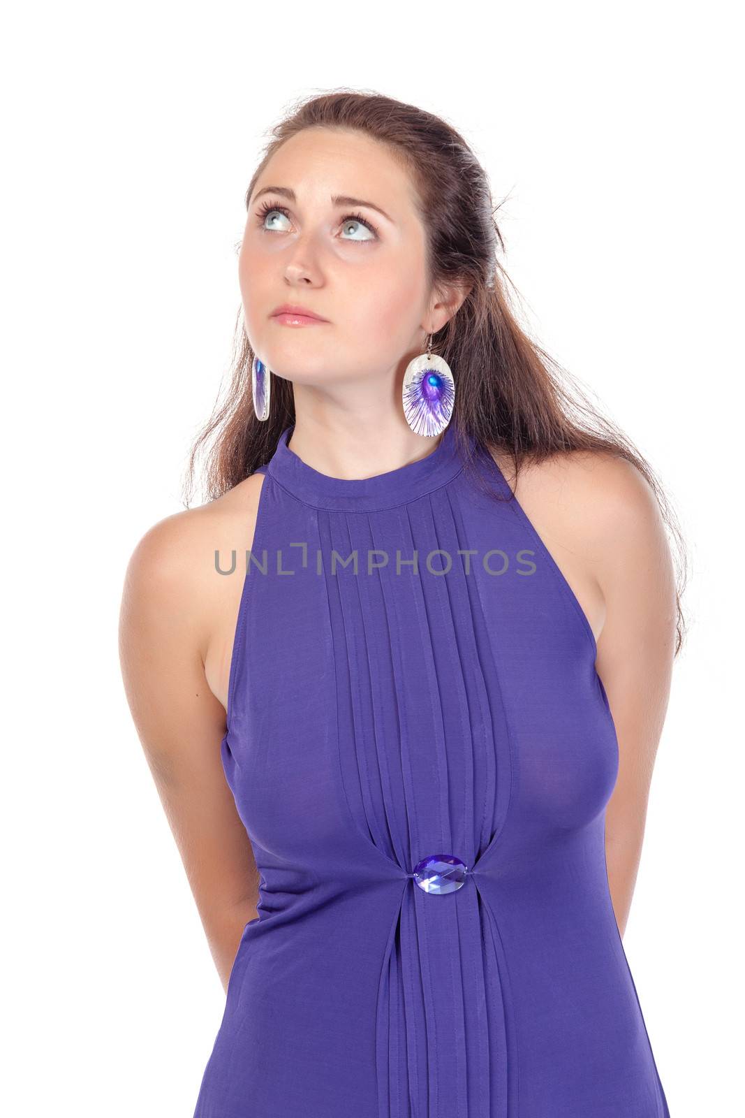 Portrait of a beautiful young woman in blue dress on white background