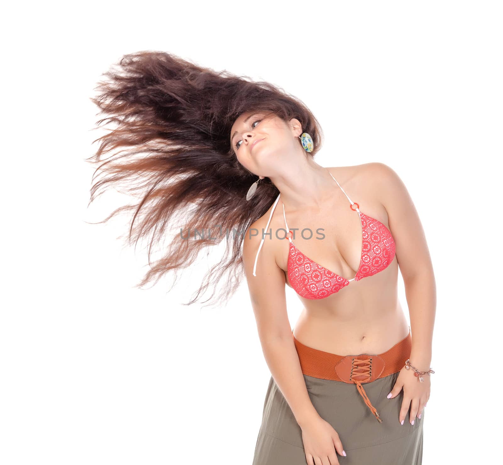 Portrait of a beautiful young woman in beach dress, with streaming hair on white background