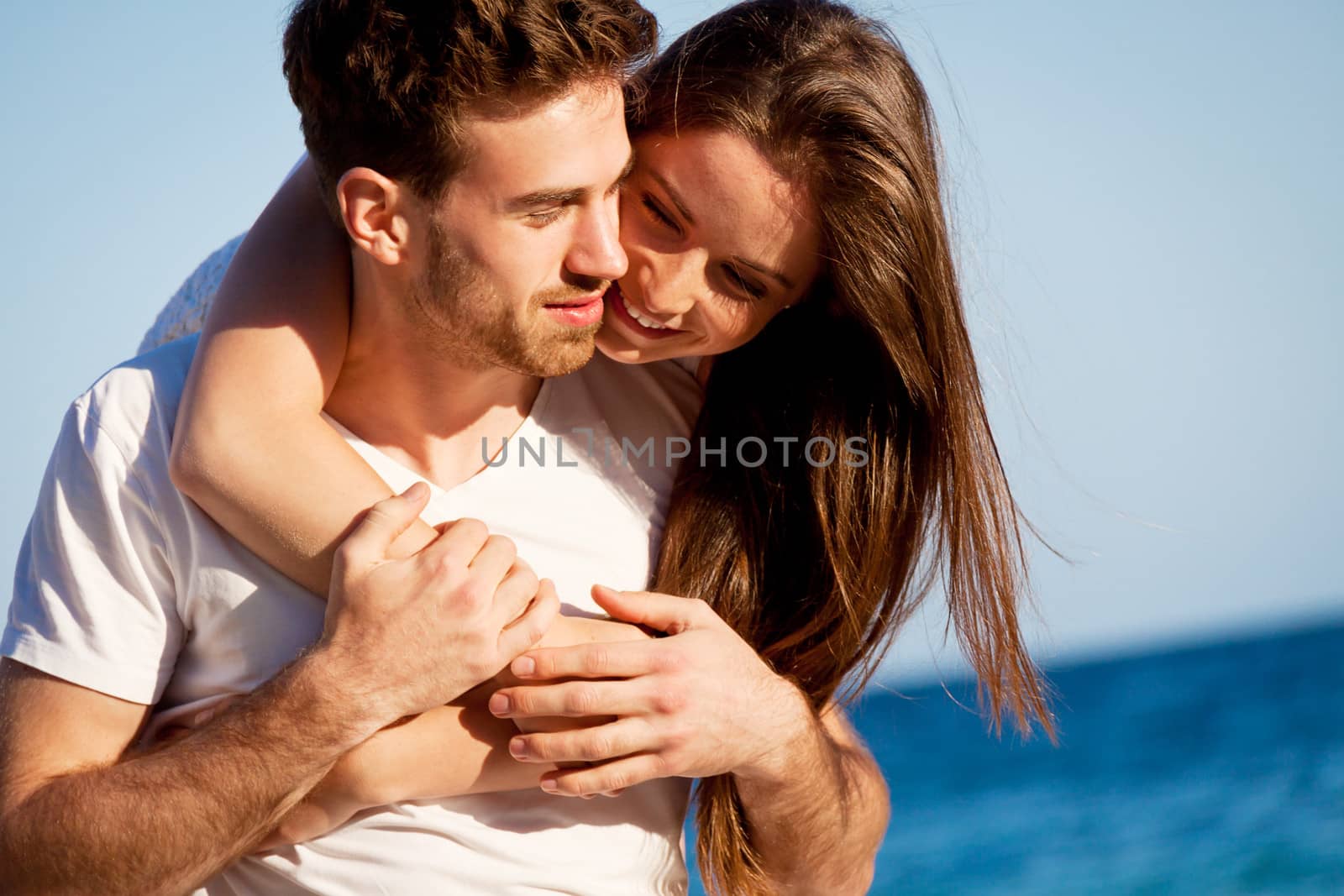 young happy couple in summer holiday vacation summertime beach