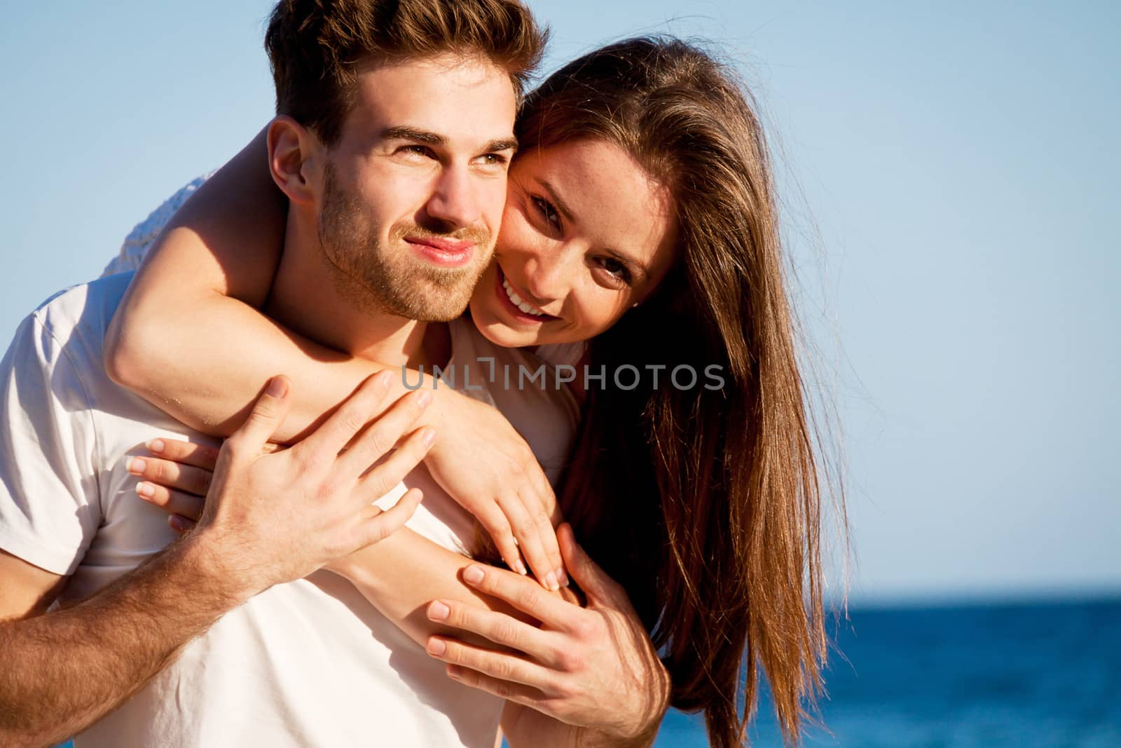 young happy couple in summer holiday vacation summertime beach