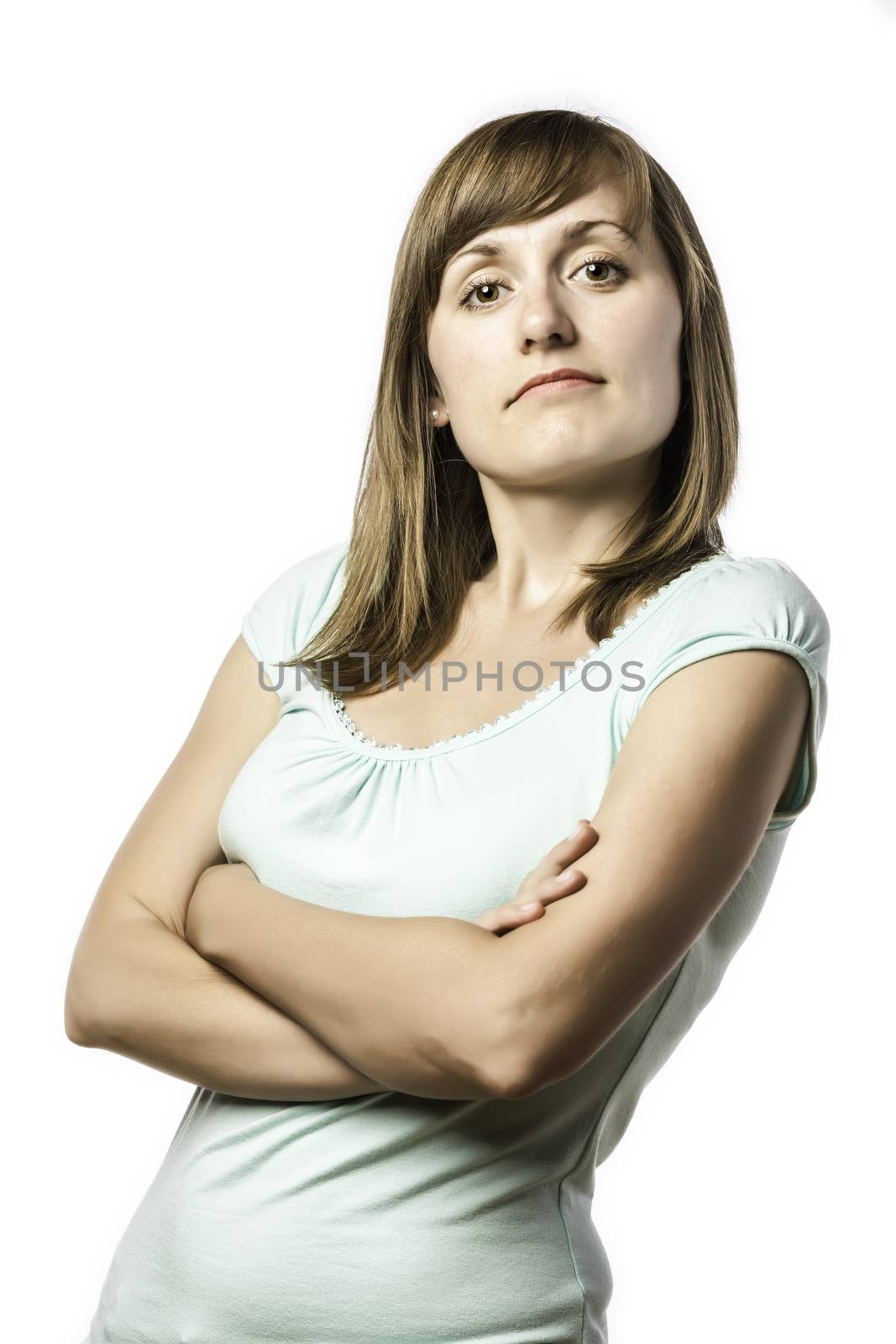 Standing young pretty woman with arrogant face, isolated on white background