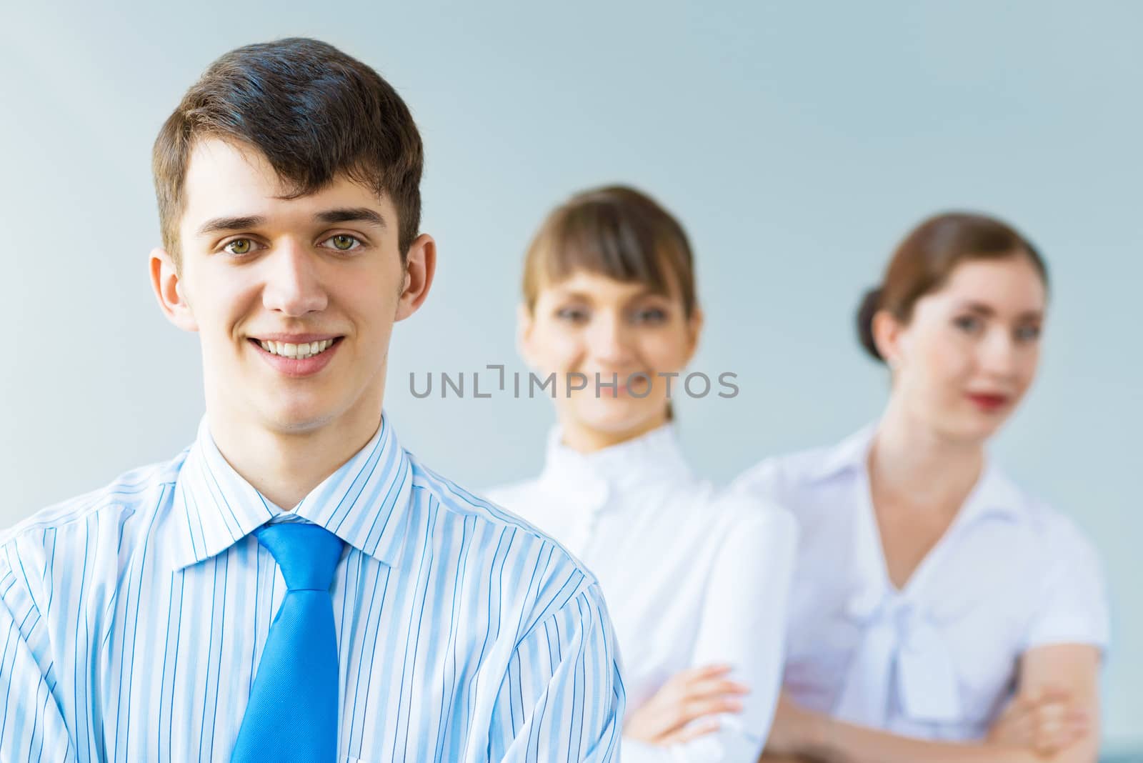 successful businessmen, a portrait of a businessman behind him are his colleagues