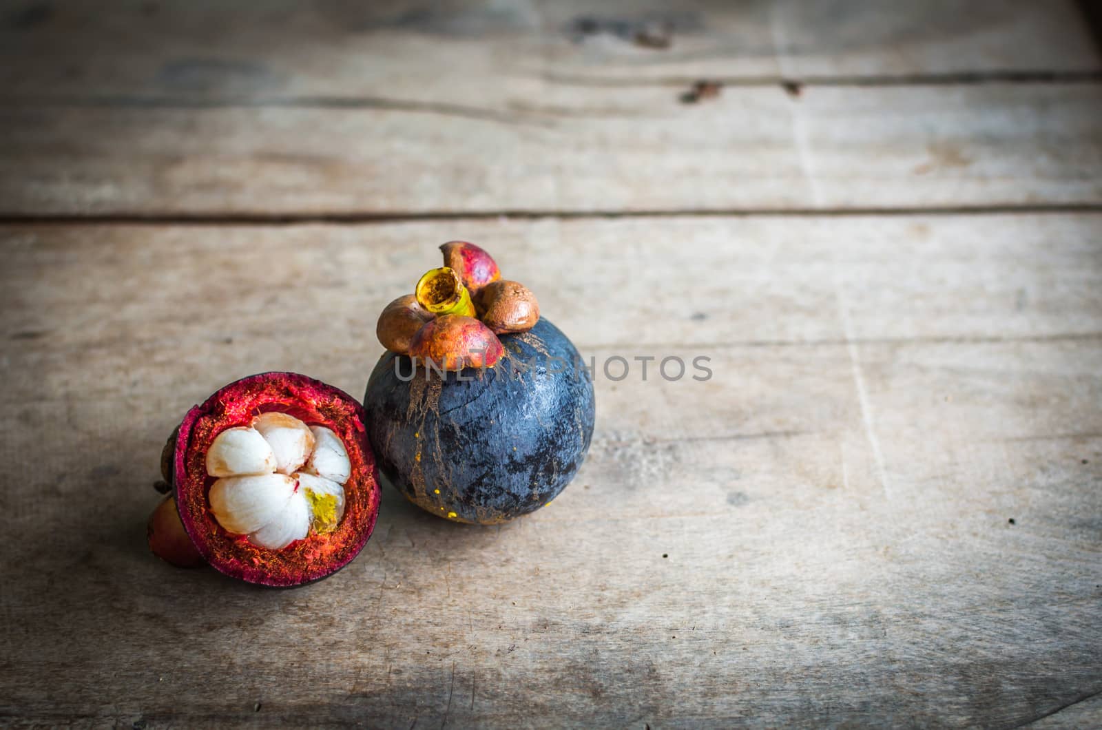 Close up of Mangosteen.By placing the components on the wood board.