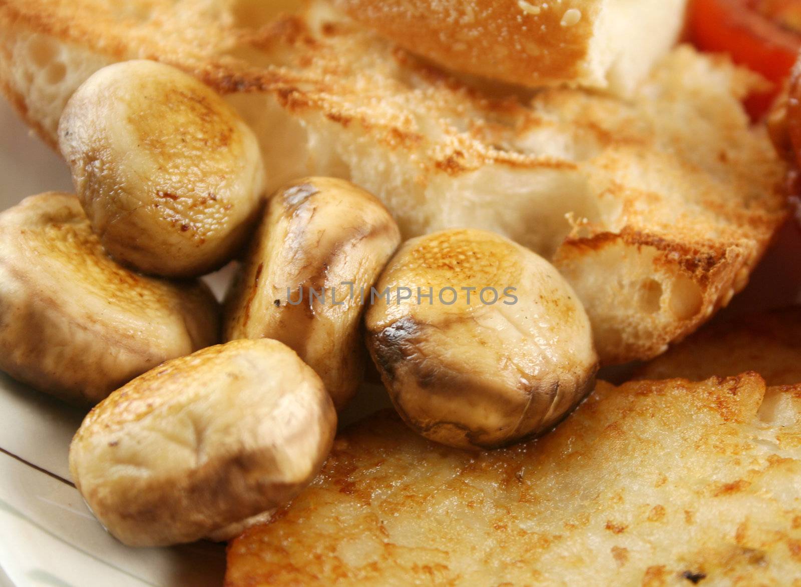 Button mushrooms with toast and a hash brown.