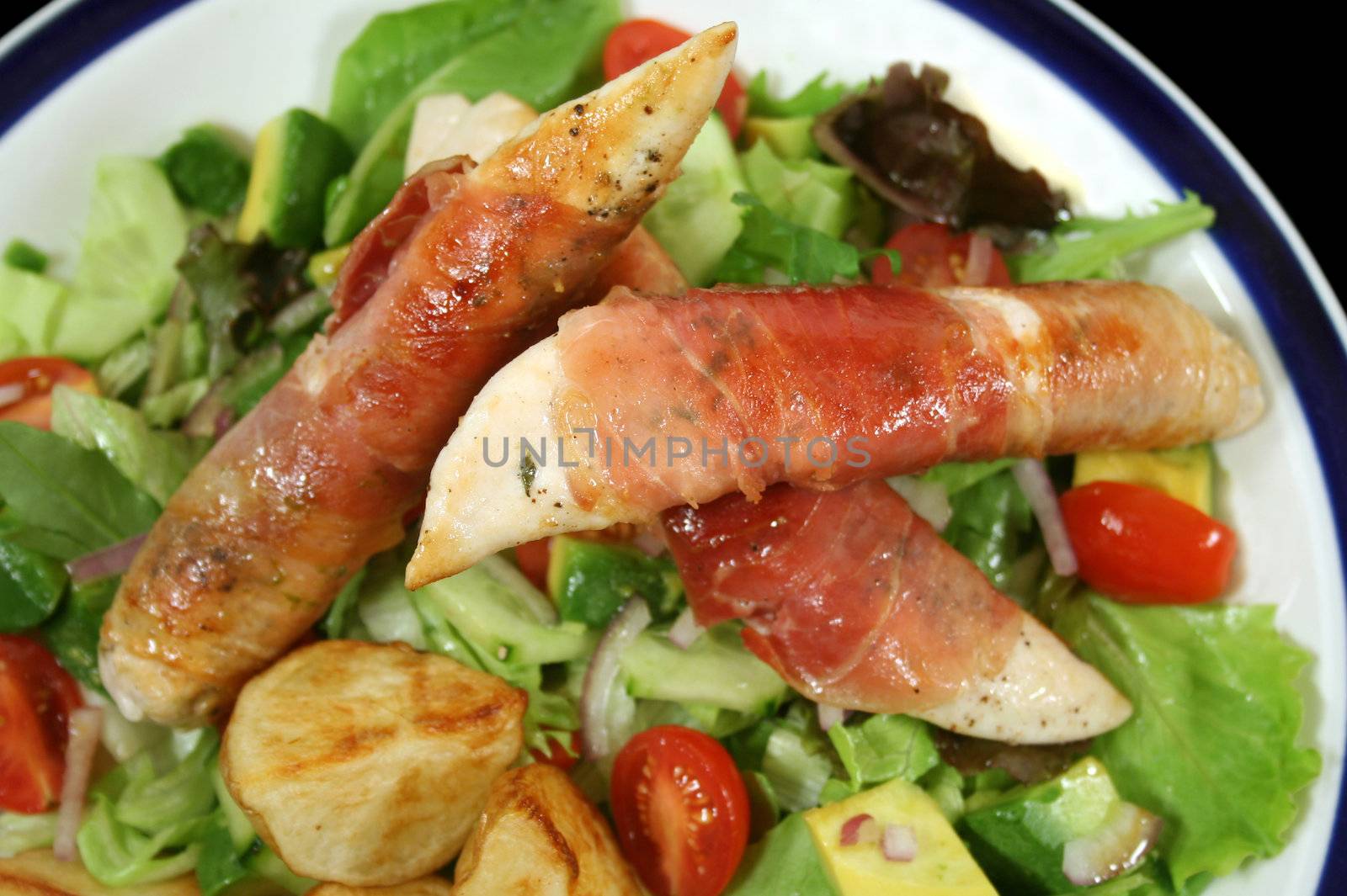 Chicken tenderloins wrapped in prosciutto with oven roasted chat potatoes and a garden salad.
