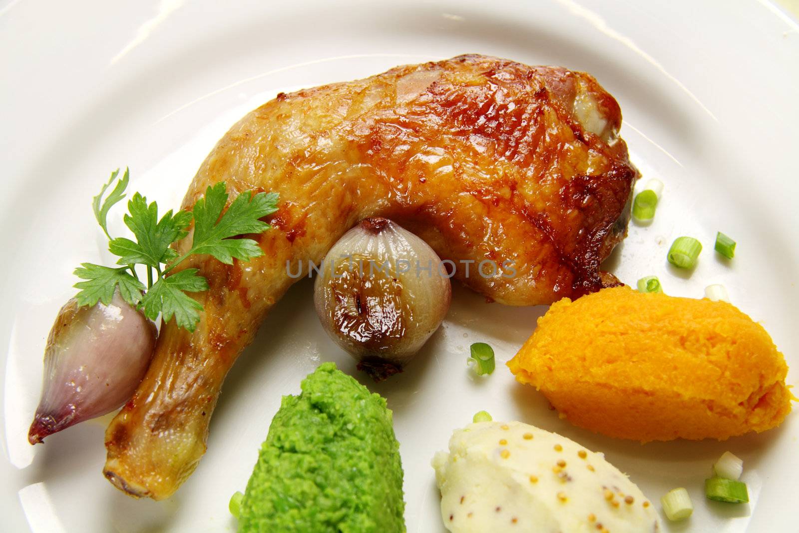 Roasted quarter of chicken with a pea, potato and butternut mash.