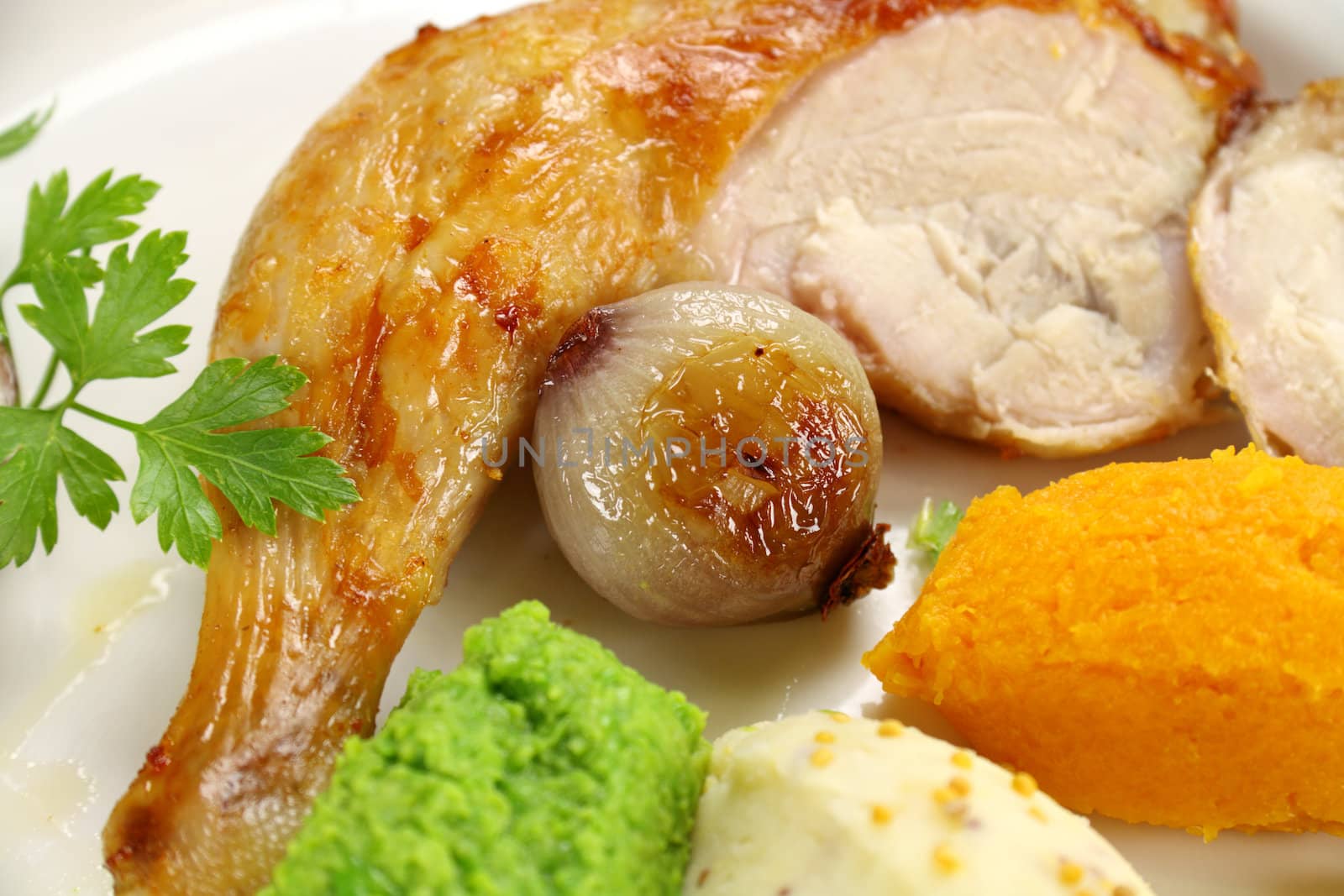 Roasted onion with a quarter of chicken with a pea, potato and butternut mash.