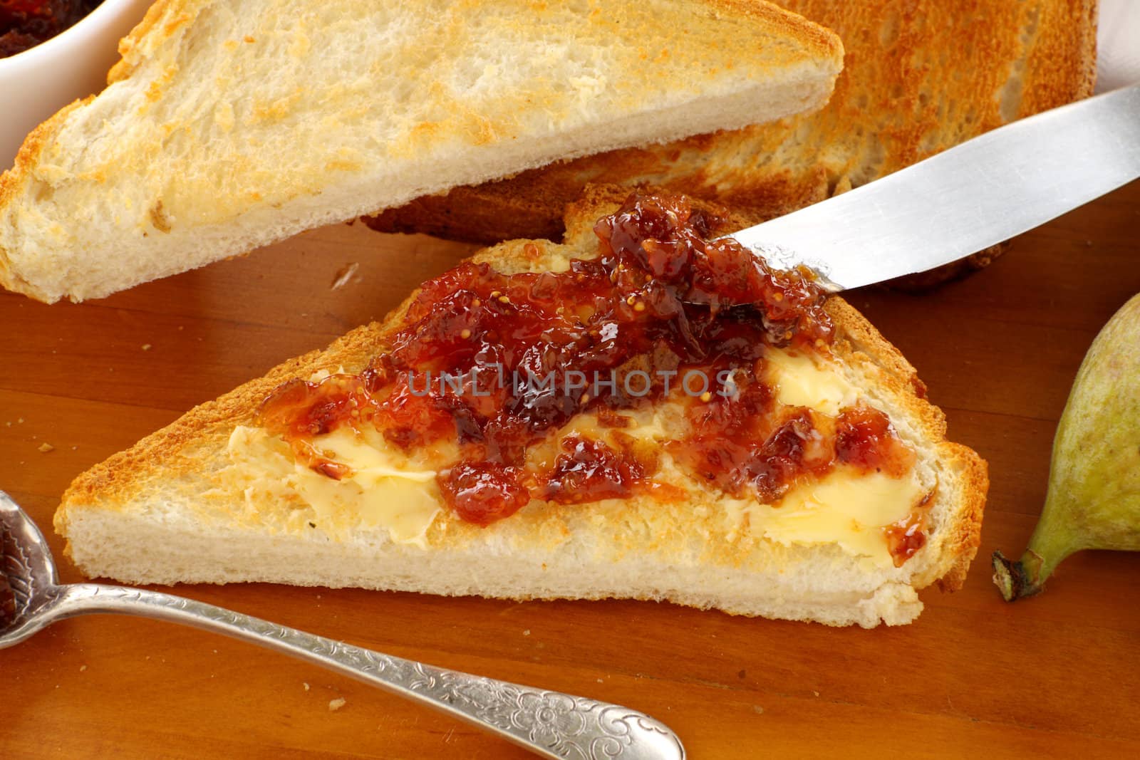 Delicious homemade fig jam spread on a slice of toast.