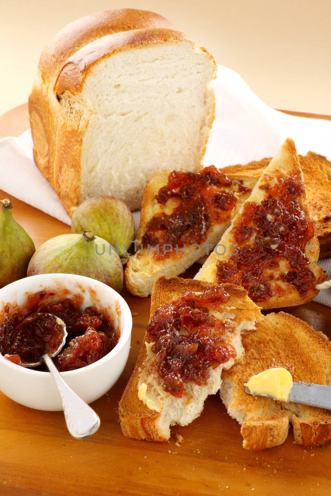 Rustic homemade fig jam sandwiches on toast ready to serve.