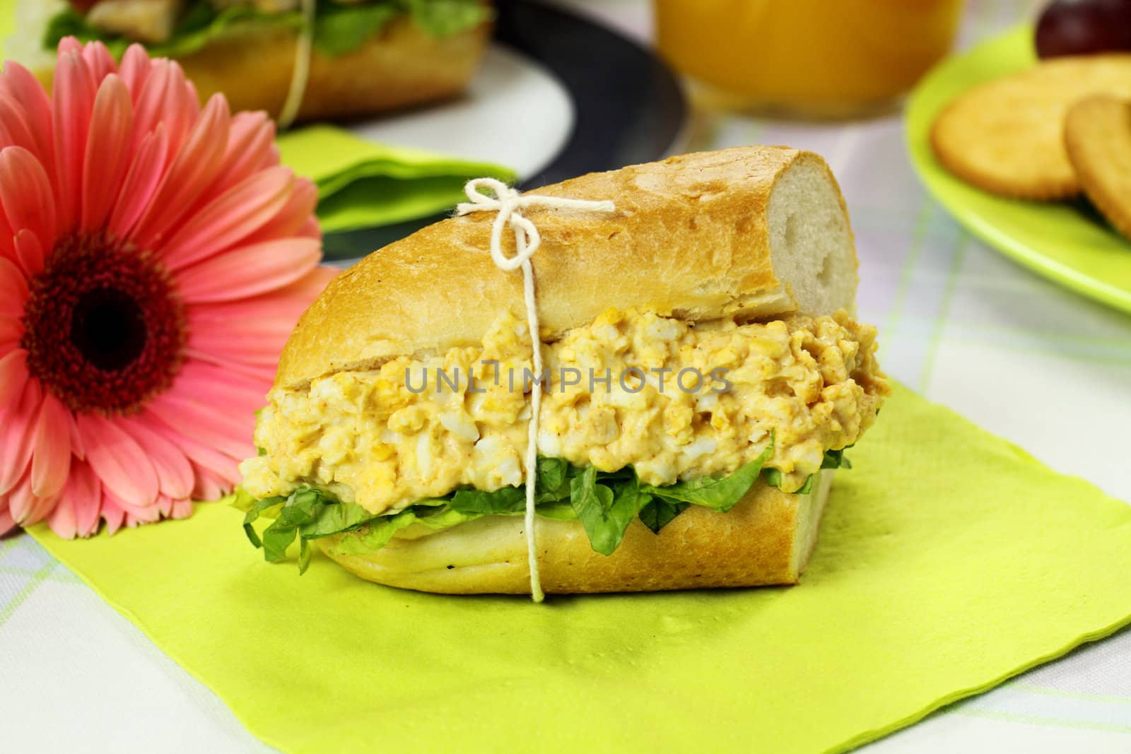 Freshly prepared curried egg and lettuce roll.