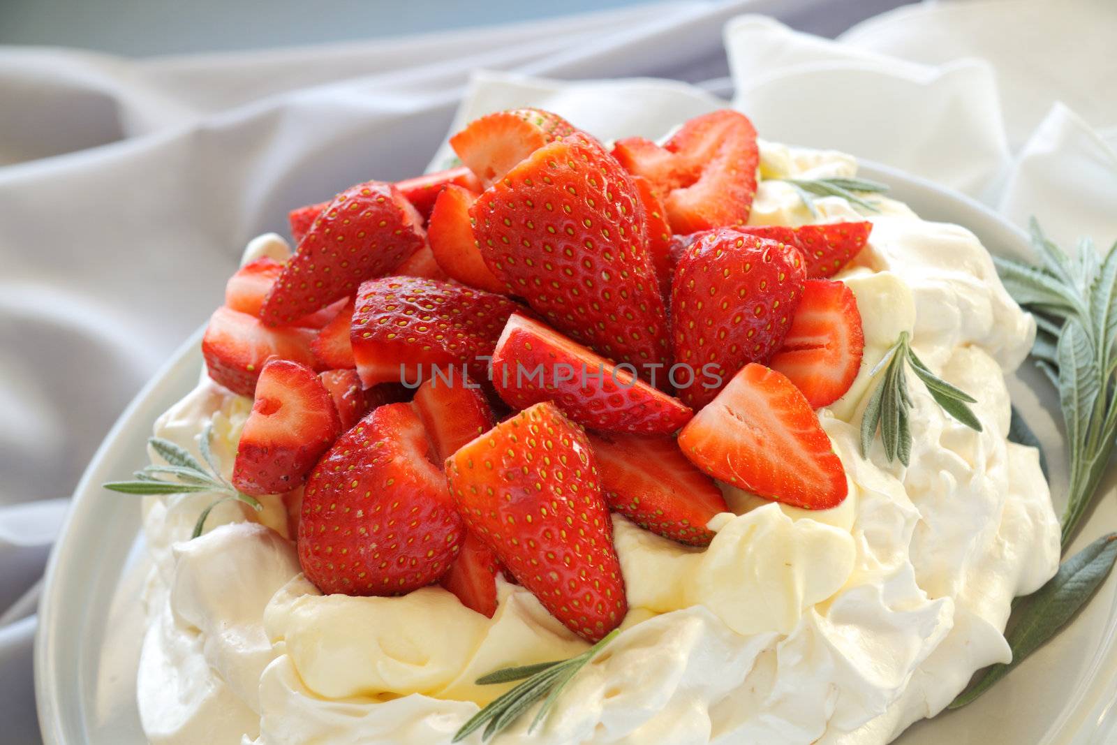 Delicious traditional Australian strawberry pavlova made from meringue and cream.