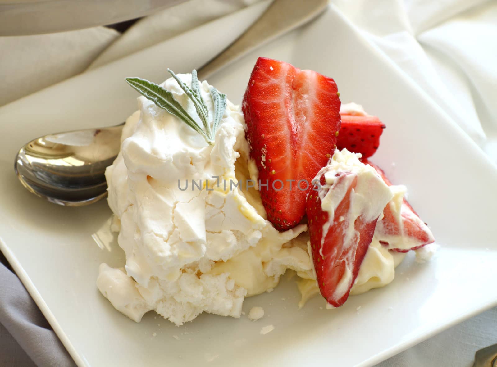Delicious traditional Australian strawberry pavlova made from meringue and cream.