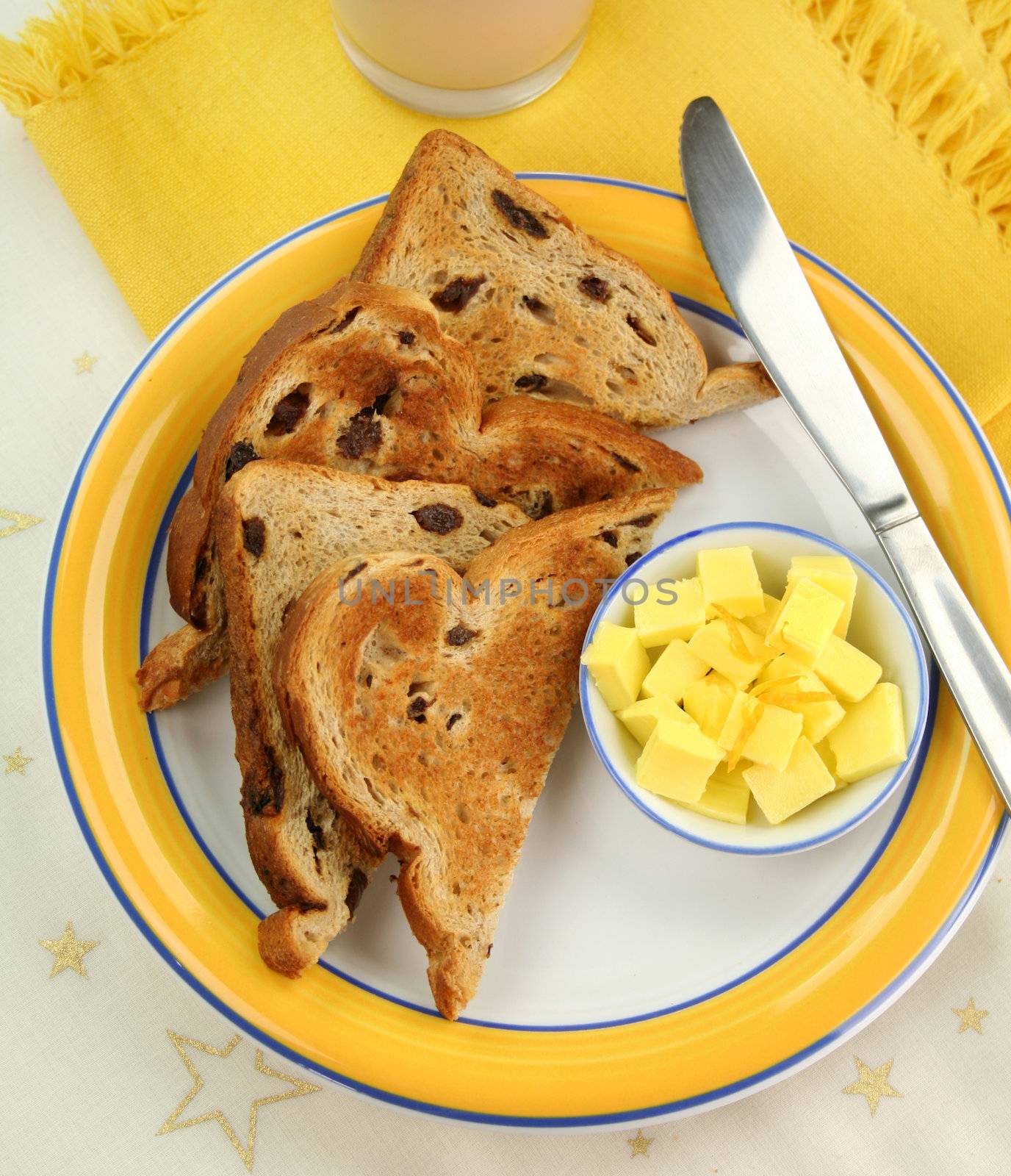 Delicious slices of toasted sultana bread with butter cubes.
