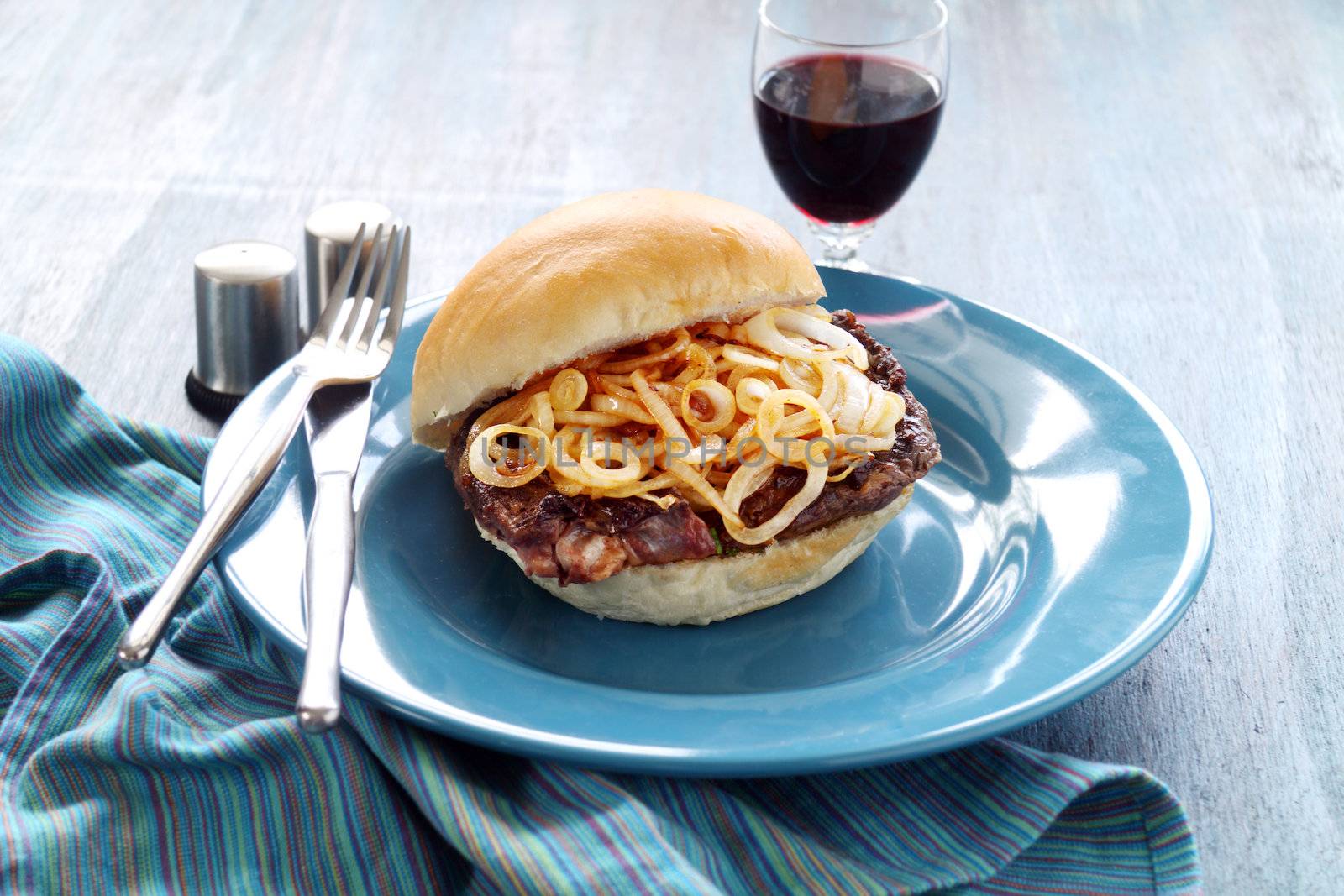 Delicious steak burger with fried onions ready to serve.