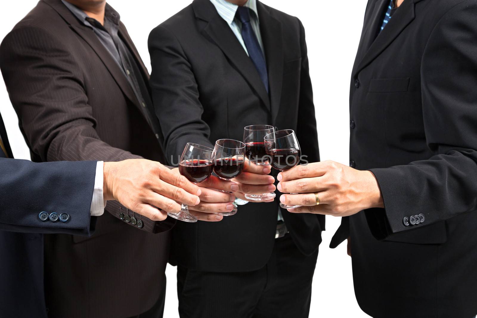 Close-up of human hands cheering up with flutes of wine