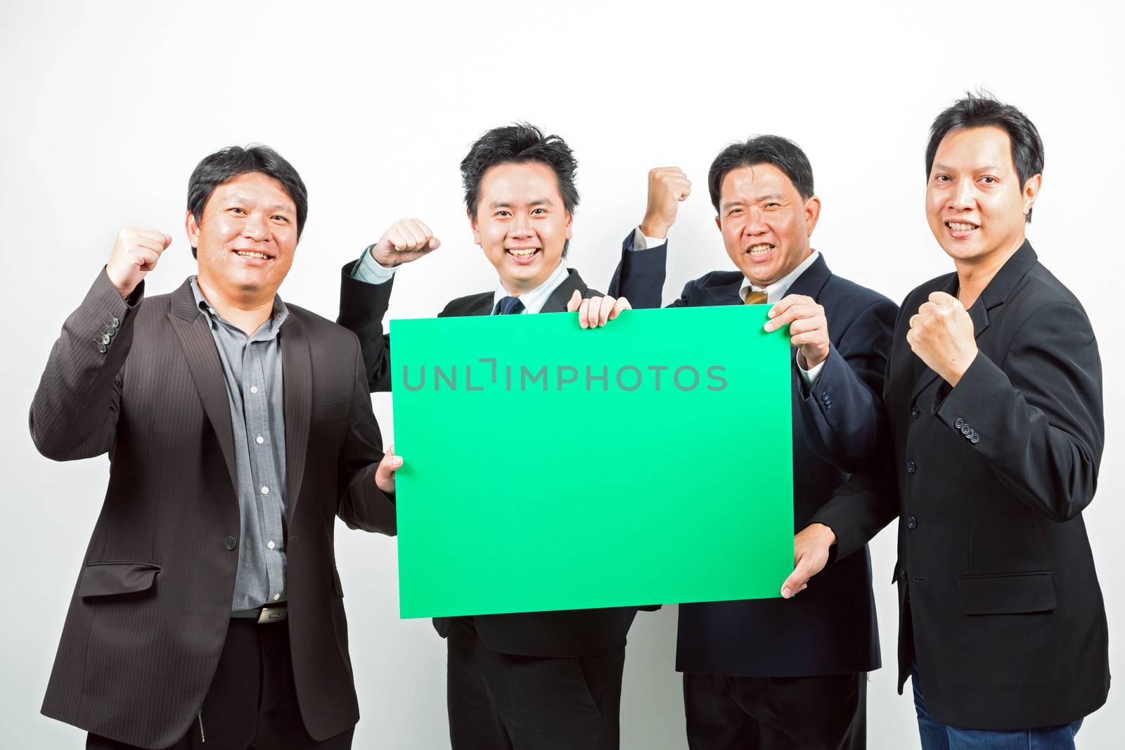 Team of Businessmen holding a blank green banner