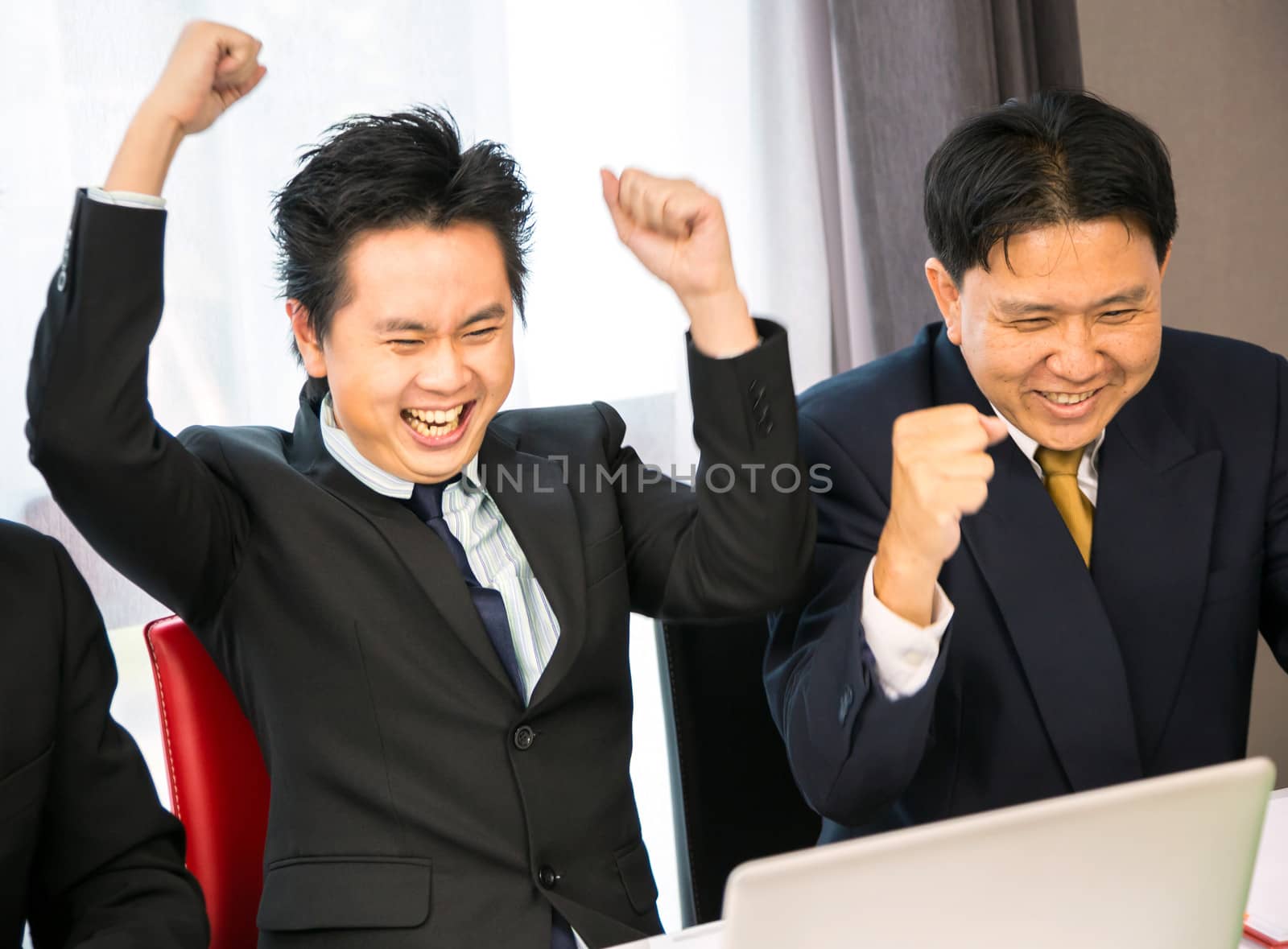 Businessmen celebrate their business success