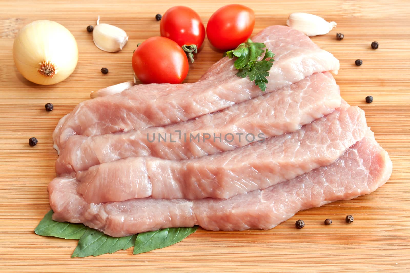 Raw pork with spices and vegetables
