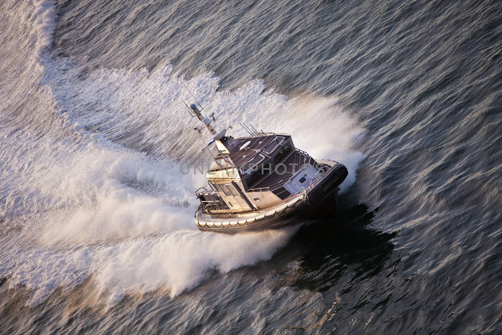 Police Boat on patrol speeding through water