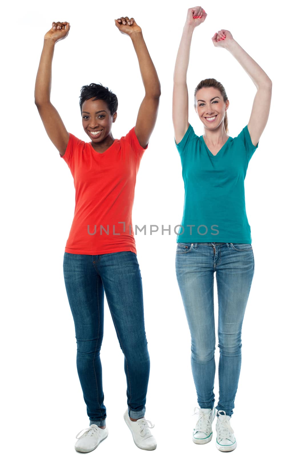 Women raising their arms up in excitement
