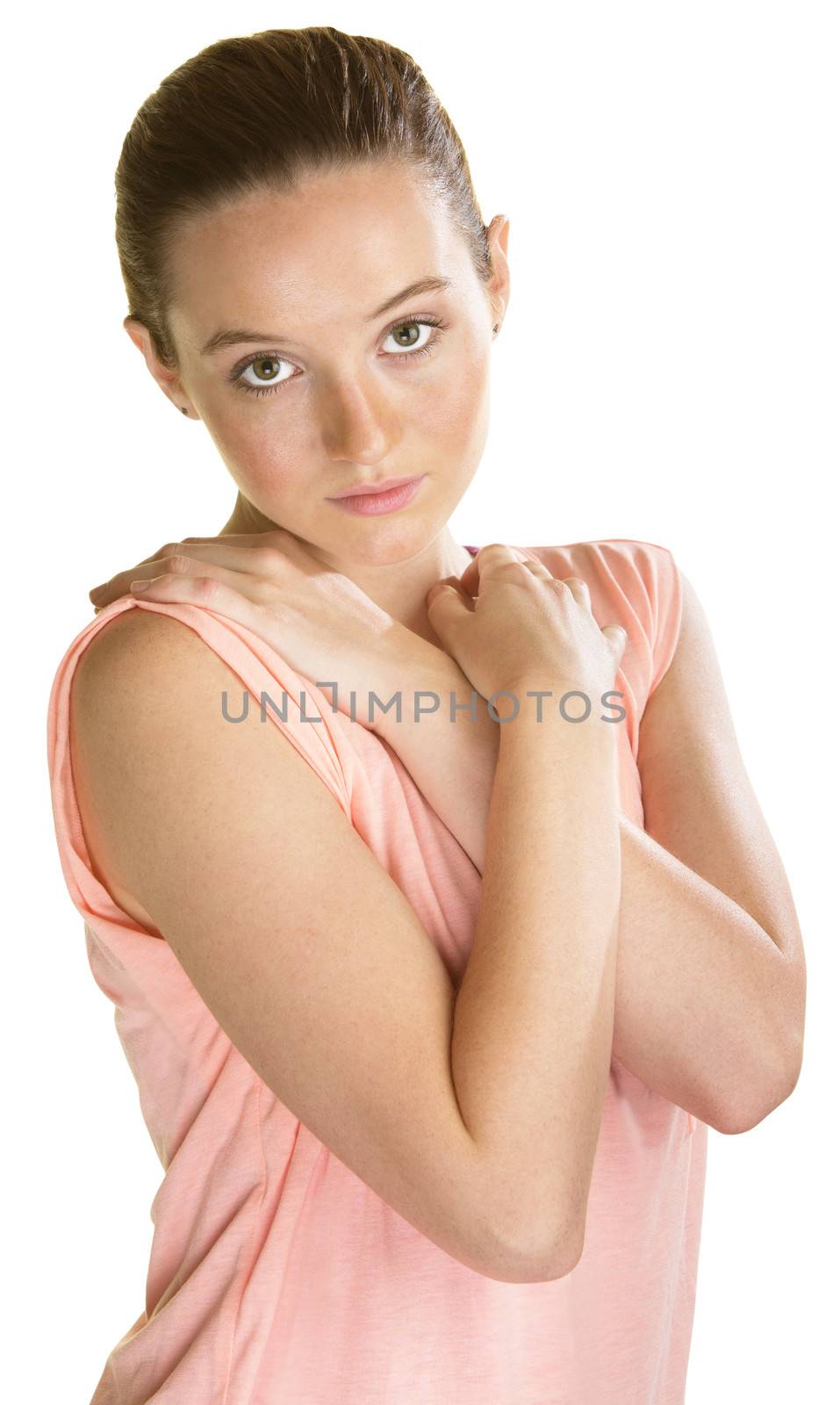 Insecure young female with arms crossed on white background